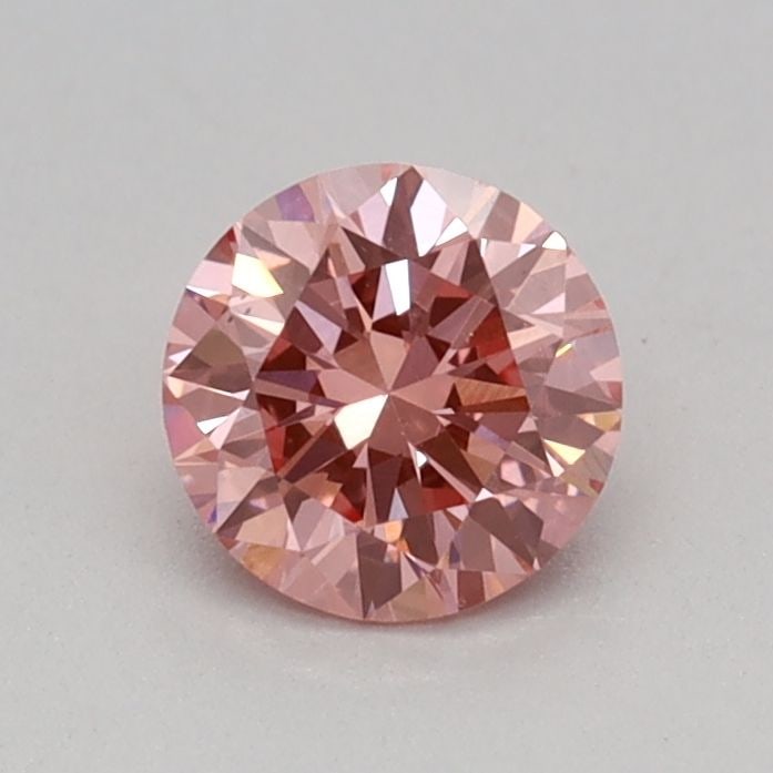 Loose Diamond - ROUND 0.32ct Fancy Vivid Pink VS2: Loose Diamond - ROUND 0.32ct Fancy Vivid Pink VS2 Source: This is a real non-mined Diamond that has been grown in a lab Shape: ROUND Carats: 0.32 Color: Fancy Vivid Pink Certification: IGI Video: