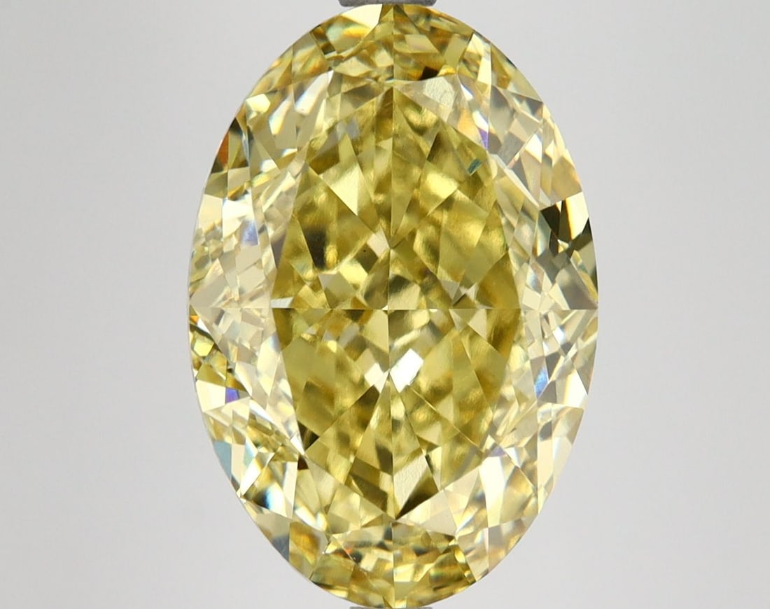 Loose Diamond - OVAL 7.06ct Fancy Vivid Yellow VS1: Loose Diamond - OVAL 7.06ct Fancy Vivid Yellow VS1 Source: This is a real non-mined Diamond that has been grown in a lab Shape: OVAL Carats: 7.06 Color: Fancy Vivid Yellow Certification: IGI Video: