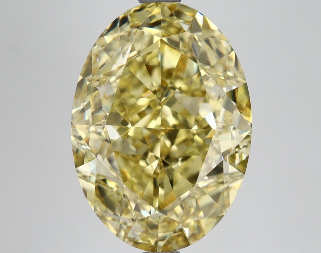 Loose Diamond - OVAL 6.61ct Fancy Vivid Yellow VVS2: Loose Diamond - OVAL 6.61ct Fancy Vivid Yellow VVS2 Source: This is a real non-mined Diamond that has been grown in a lab Shape: OVAL Carats: 6.61 Color: Fancy Vivid Yellow Certification: IGI Video: