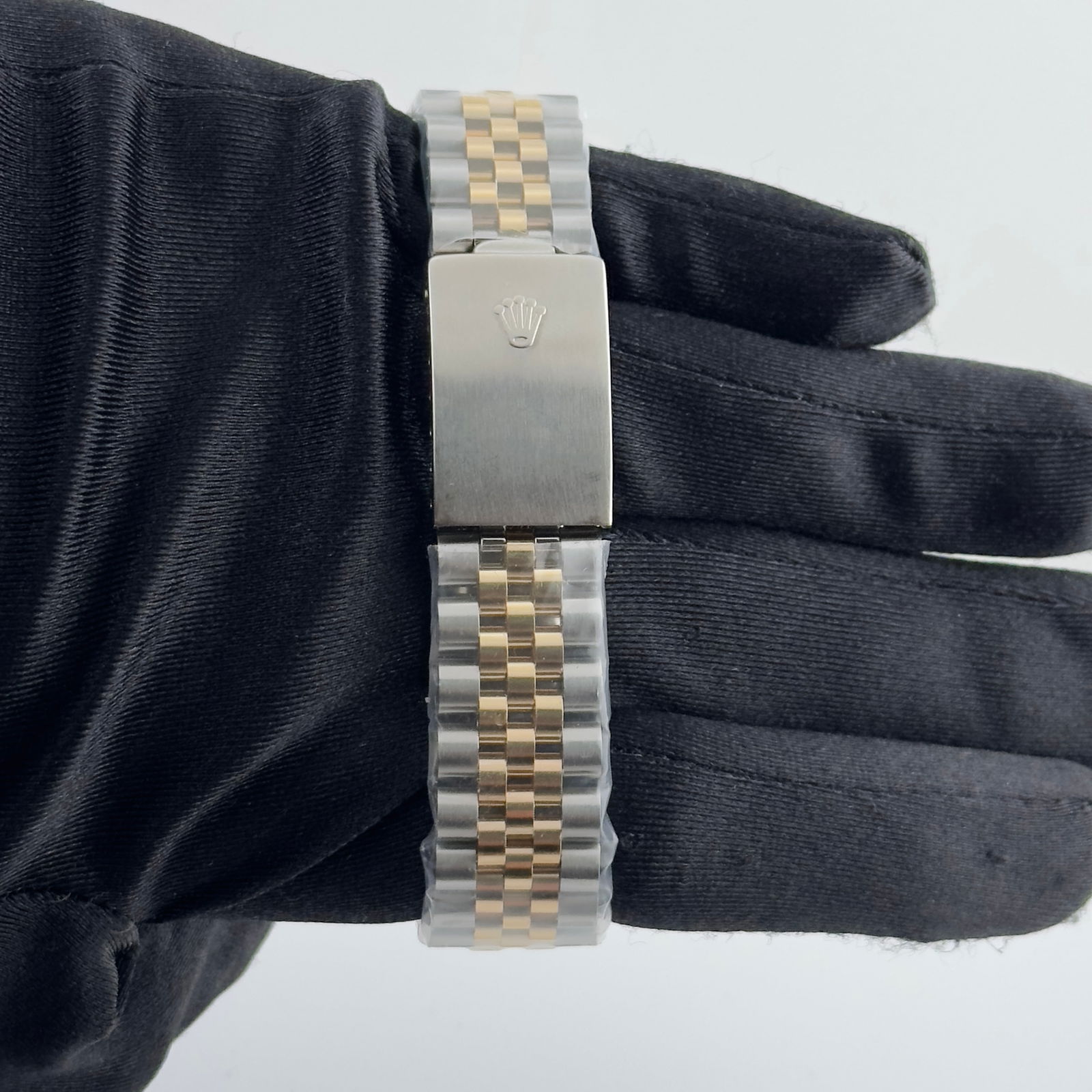 Champagne Diamond Dial Datejust Reference 1601 with Aftermarket Jubilee Bracelet: Champagne Diamond Dial Datejust Reference 1601 with Aftermarket Jubilee Bracelet This Rolex Datejust features a champagne dial adorned with diamond markers and is paired with an aftermarket Jubilee br