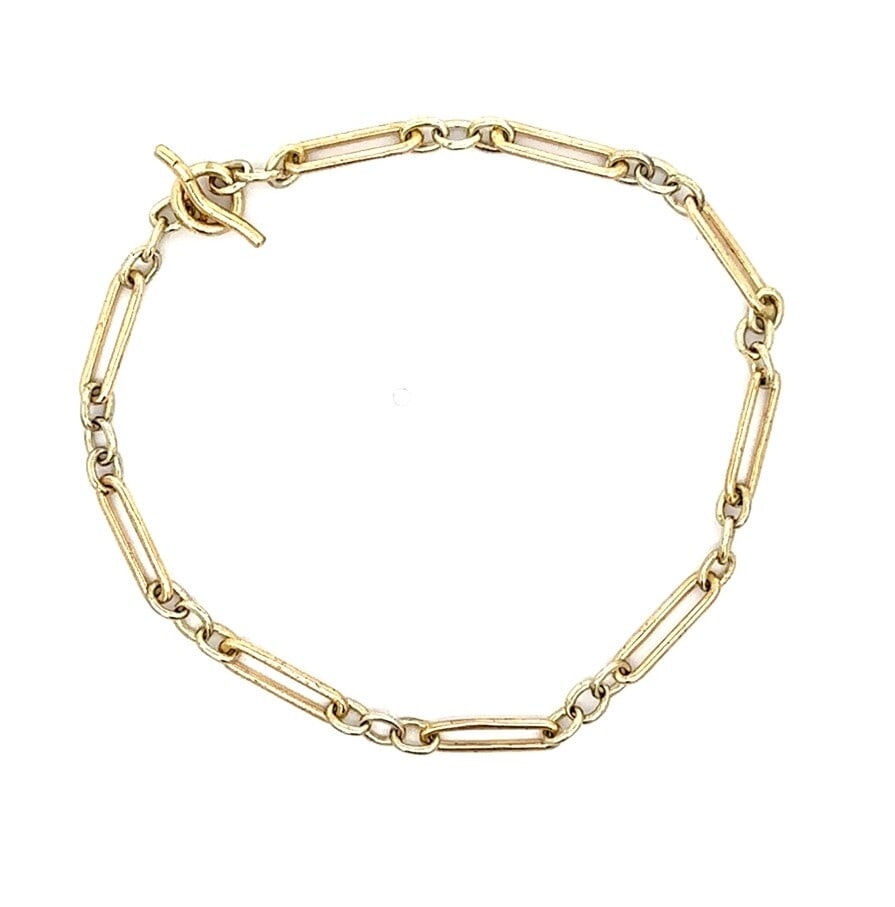 Antique 9k Gold Charm Chain Bracelet with Toggle Clasp: Antique 9k Gold Charm Chain Bracelet with Toggle Clasp This exquisite antique 9k gold bracelet features an elegant open oval and round wire link design, complemented by a secure toggle clasp. Crafted
