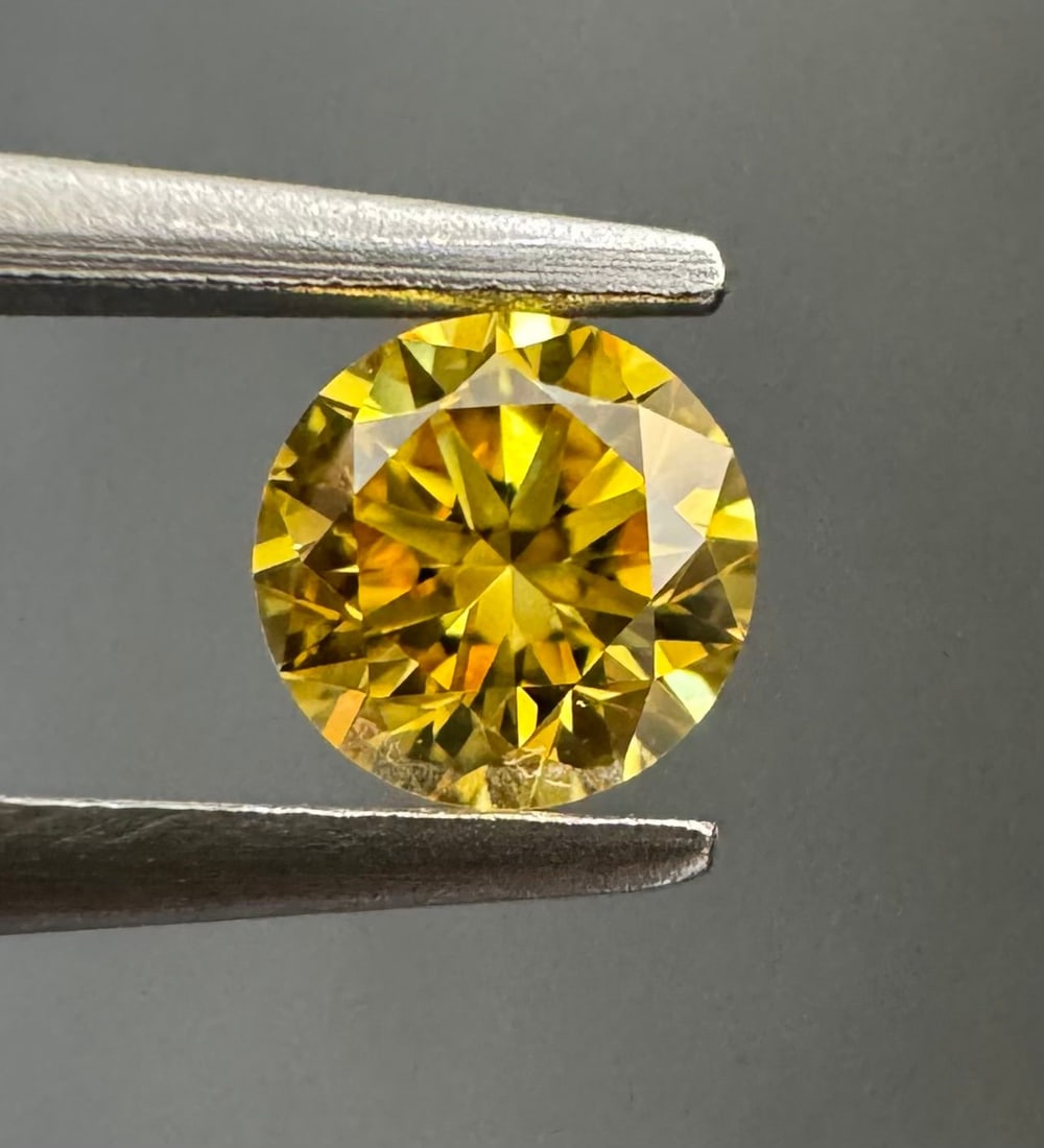 Loose Diamond - ROUND 0.19ct Fancy Vivid Orangey Yellow VS1: Loose Diamond - ROUND 0.19ct Fancy Vivid Orangey Yellow VS1 Source: Natural Shape: ROUND Carats: 0.19 Color: Fancy Vivid Orangey Yellow Certification: GIA PLEASE NOTE: Framed, Large, or heavy items do