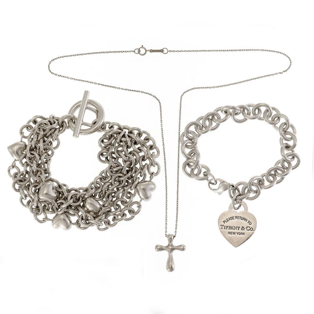 Tiffany & Co Sterling Silver Set of 3 Jewelry with Peretti Cross: Tiffany & Co Sterling Silver Set of 3 Jewelry with Peretti Cross Discover this exquisite set of authentic Tiffany & Co. jewelry, crafted from high-quality sterling silver. This collection includes two