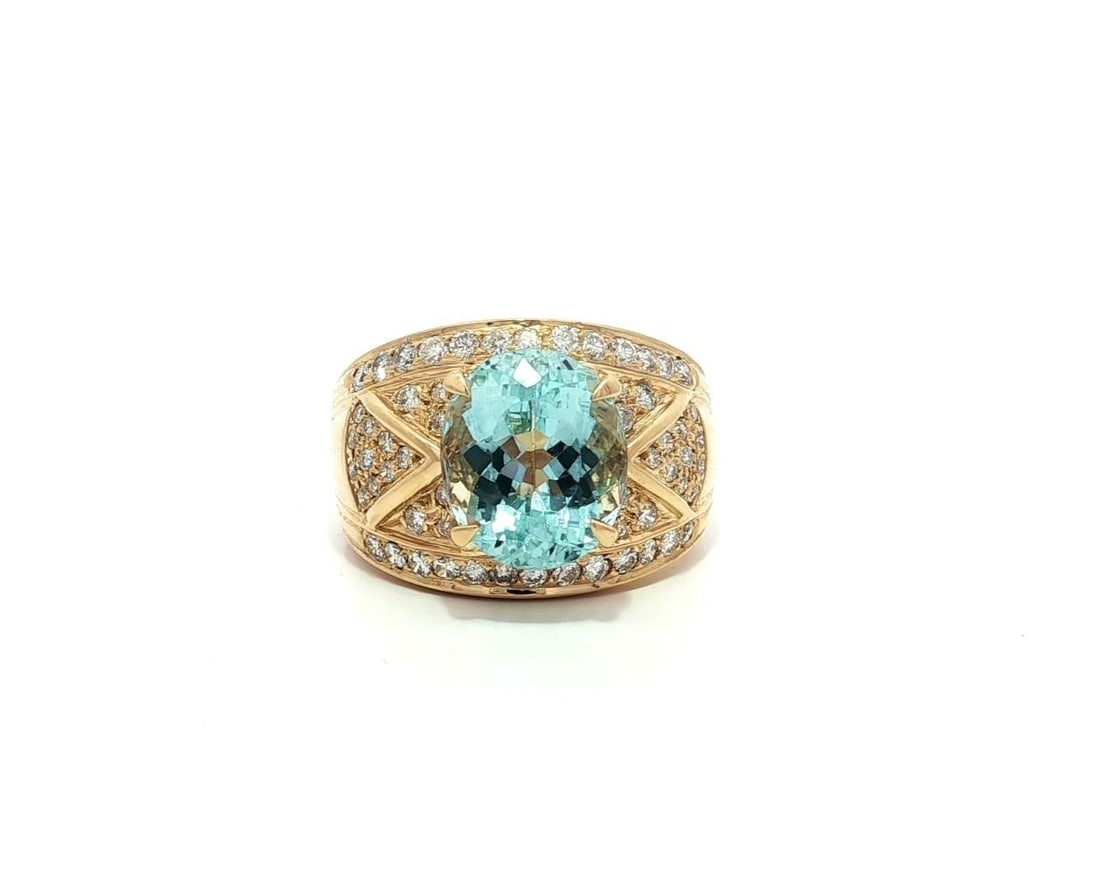 18k Yellow Gold 4.53ct Aquamarine Diamond Wide Cigar Band Ring: 18k Yellow Gold 4.53ct Aquamarine Diamond Wide Cigar Band Ring This stunning 18k Yellow Gold Cigar Band Ring features a captivating 4.53ctw of gemstones. The main attraction is a natural, oval-cut aqu