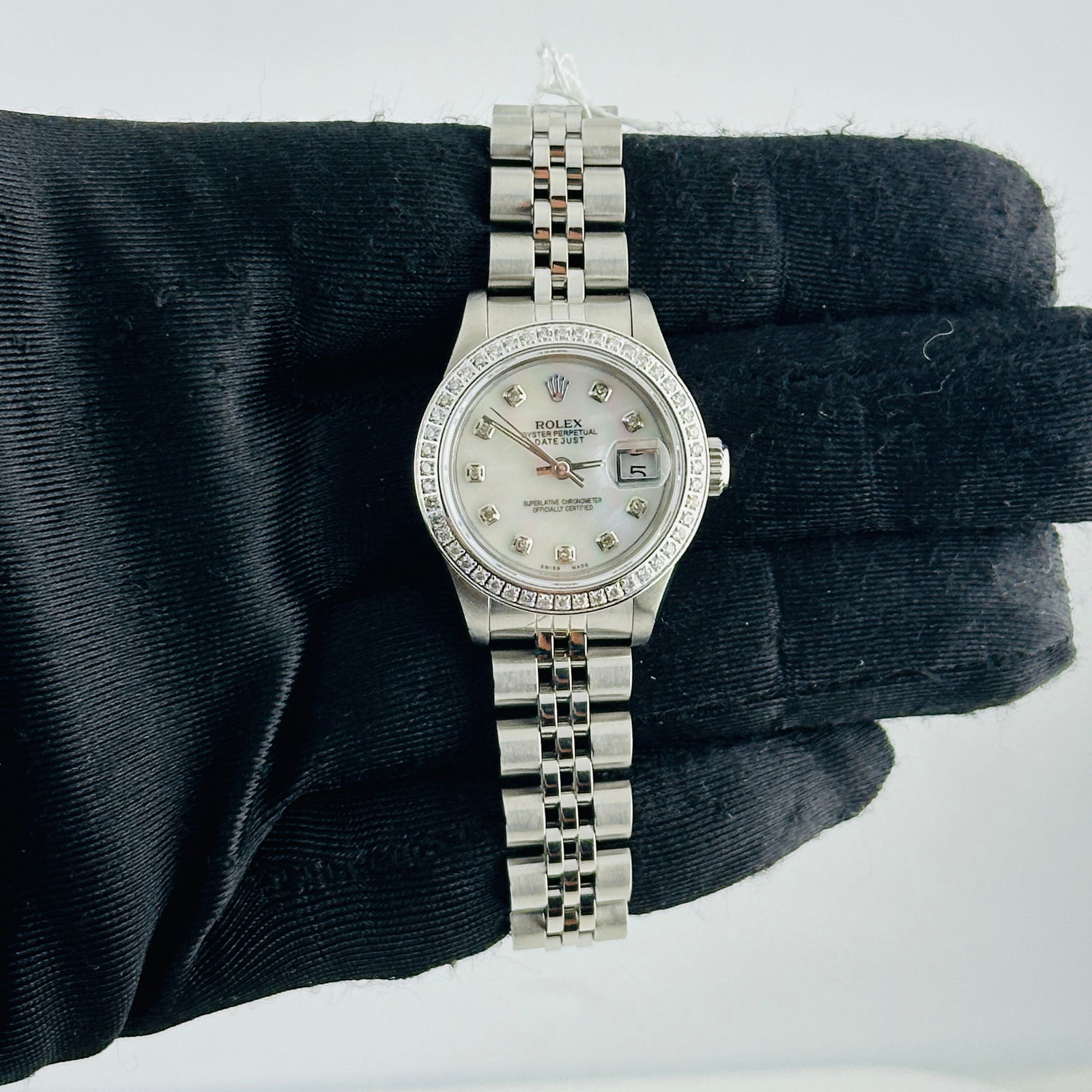 Ladies Datejust 69240 White MOP Diamond Dial Jubilee Watch: Ladies Datejust 69240 White MOP Diamond Dial Jubilee Watch This ladies' Rolex Datejust features an aftermarket white mother of pearl diamond dial and a pave diamond bezel, paired with a Jubilee bracel