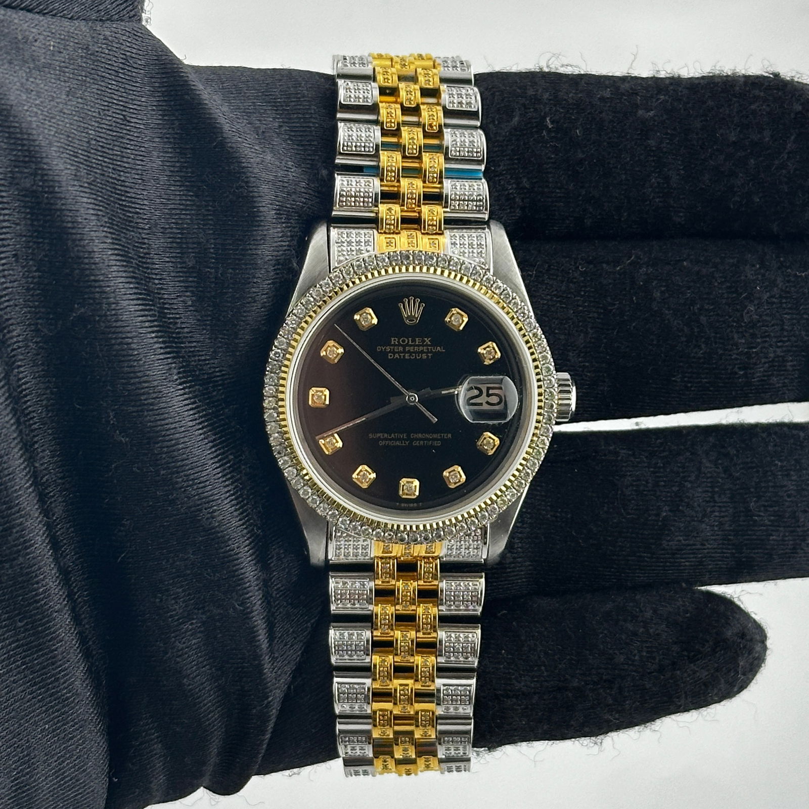 Rolex 1601-3 Datejust Mens Watch With Aftermarket Black Diamond Dial: Rolex 1601-3 Datejust Mens Watch With Aftermarket Black Diamond Dial This men's Rolex Datejust features an Aftermarket black diamond dial, a prong-plated diamond bezel, and an Aftermarket Jubilee iced