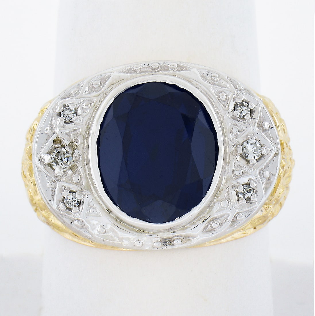 Vintage 18k Two Tone Gold Lab Created Sapphire Diamond Band Ring: Vintage 18k Two Tone Gold Lab Created Sapphire Diamond Band Ring This exquisite vintage band ring showcases a stunning oval lab-created sapphire, beautifully complemented by six genuine diamonds in a