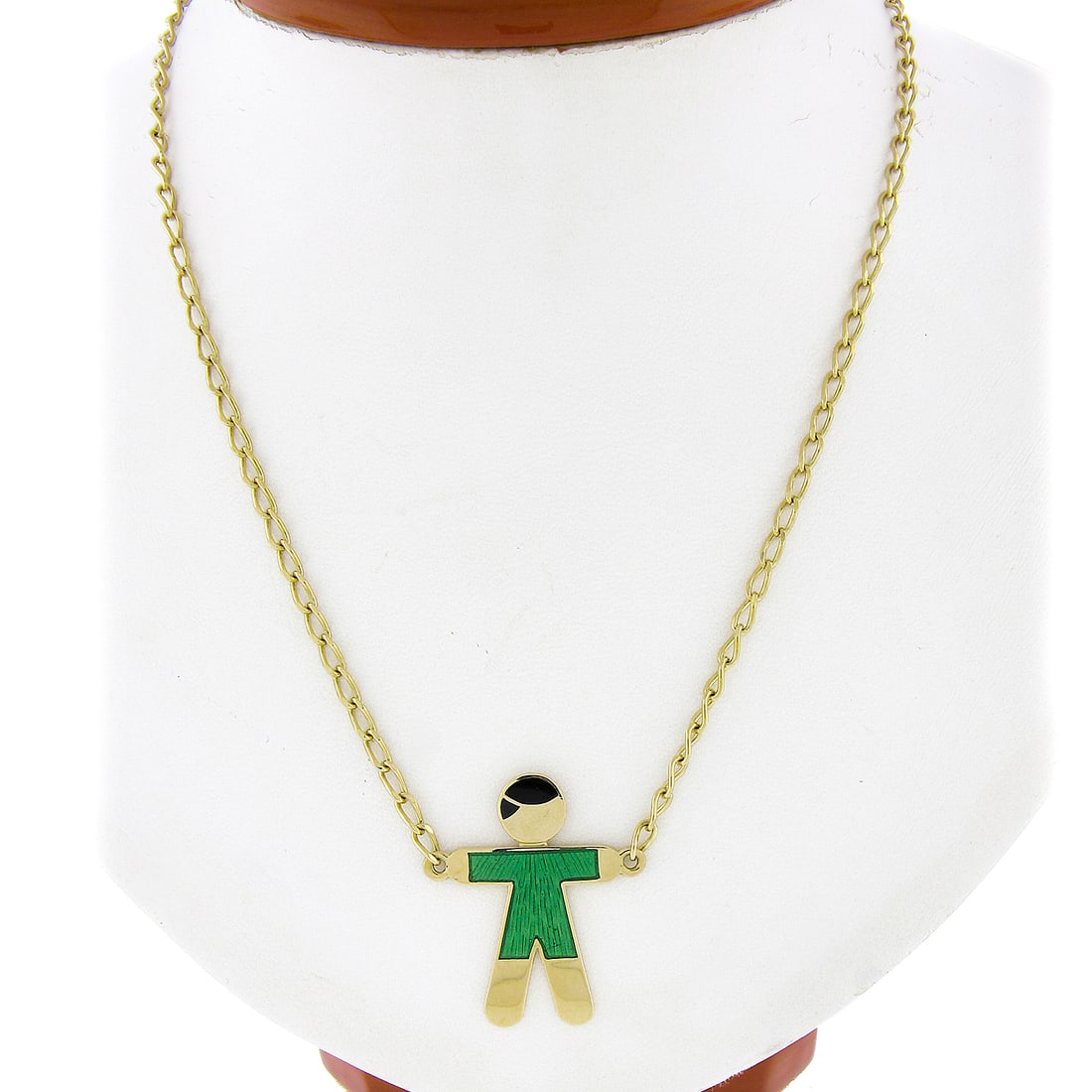 18k Yellow Gold Child Pendant with Green Black Enamel on 16.75in Chain: 18k Yellow Gold Child Pendant with Green Black Enamel on 16.75in Chain This exquisite pendant features a charming child figure crafted from solid 18k yellow gold, beautifully adorned with green and bl