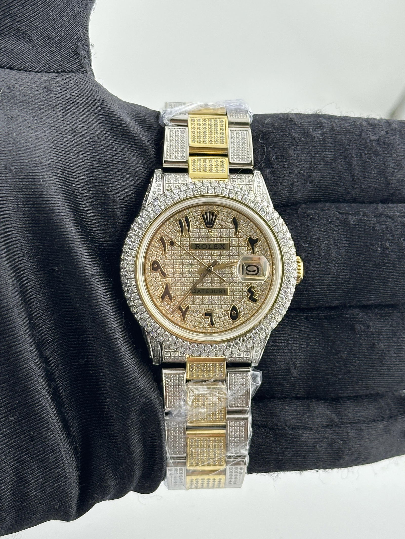 Diamond Arabic Dial Rolex Datejust 1601 with Aftermarket Diamond Oyster Bracelet: Diamond Arabic Dial Rolex Datejust 1601 with Aftermarket Diamond Oyster Bracelet This men's Rolex Datejust features a diamond Arabic dial, a two-row diamond bezel, and an aftermarket diamond Oyster br