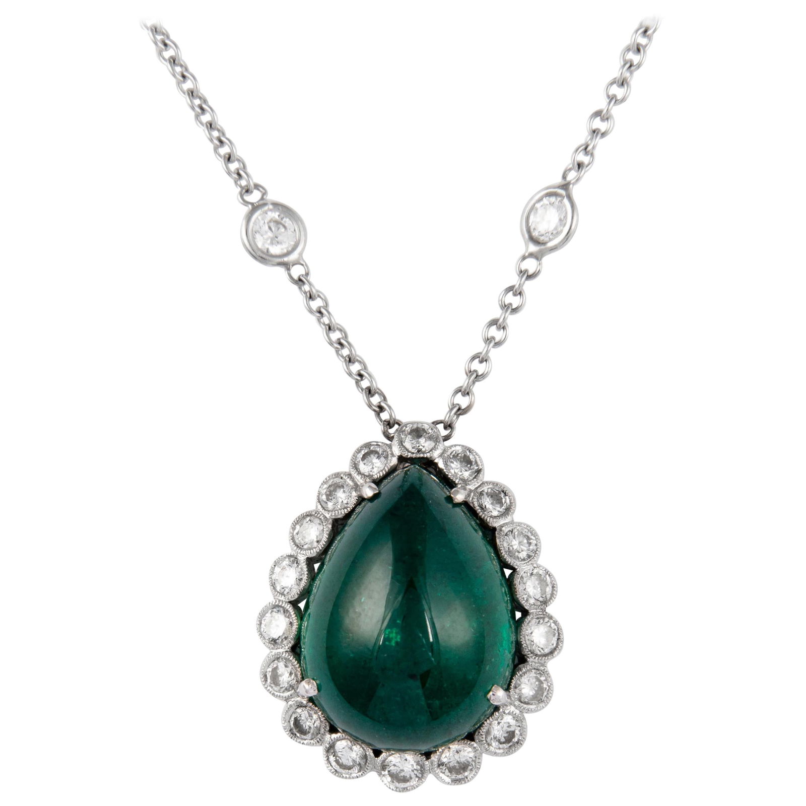 13.29 carats total Pear cabochon emerald Diamond Necklace 18k White Gold: 13.29 carats total Pear cabochon emerald Diamond Necklace 18k White Gold This exquisite necklace features a stunning 12.31 carat pear cabochon emerald, surrounded by a dazzling diamond halo. Crafted f