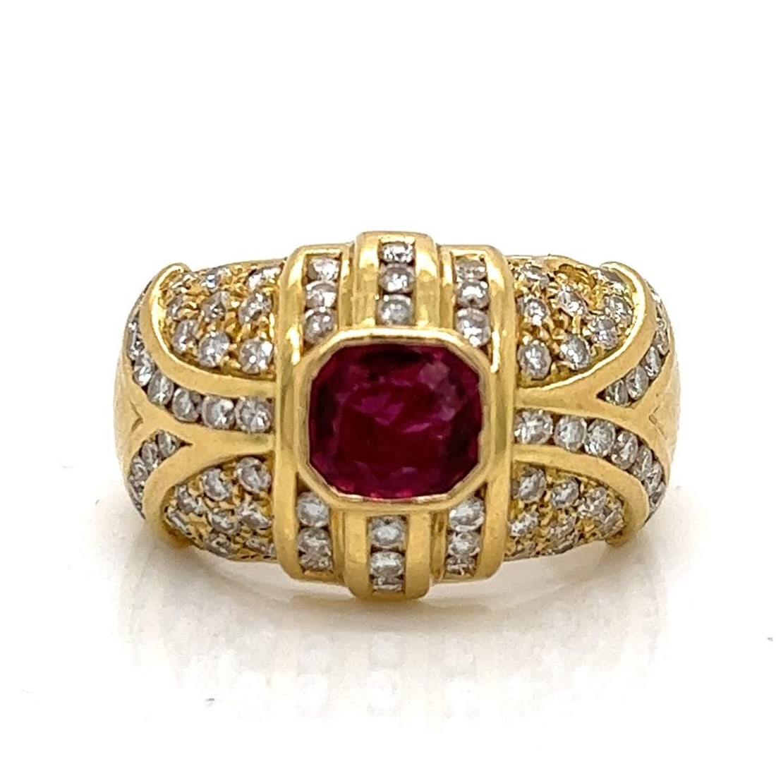 18K Yellow Gold Ruby 1.50 Ct and 82 Diamonds Ring: 18K Yellow Gold Ruby 1.50 Ct and 82 Diamonds Ring This exquisite 18K Yellow Gold ring features a captivating center ruby weighing approximately 1.50 Ct, surrounded by an impressive arrangement of 82 d