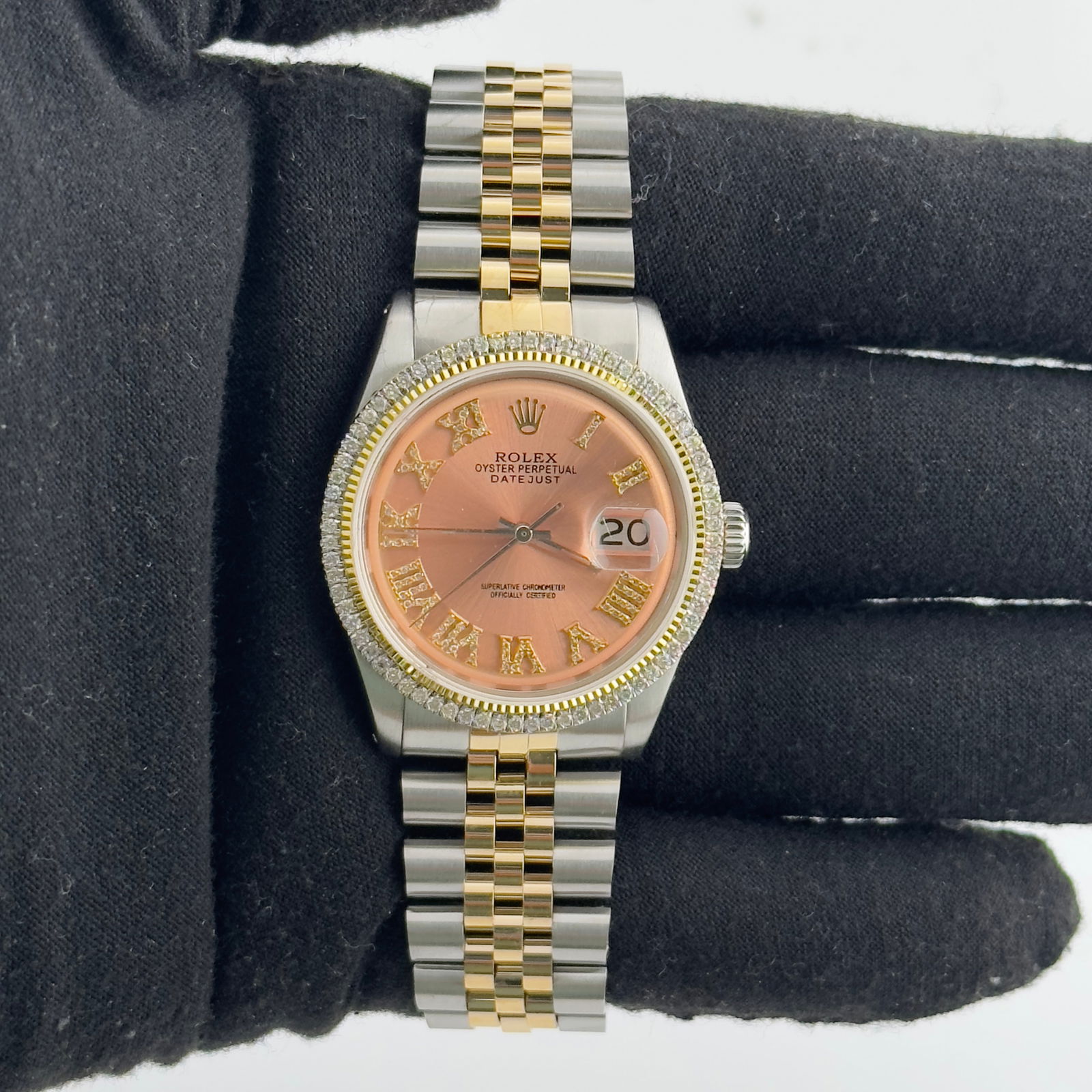 Datejust 1601 Mens Watch with Aftermarket Pink Roman Diamond Dial and Jubilee: Datejust 1601 Mens Watch with Aftermarket Pink Roman Diamond Dial and Jubilee This Rolex Datejust features an Aftermarket pink Roman diamond dial and a prong plated diamond bezel, paired with an After