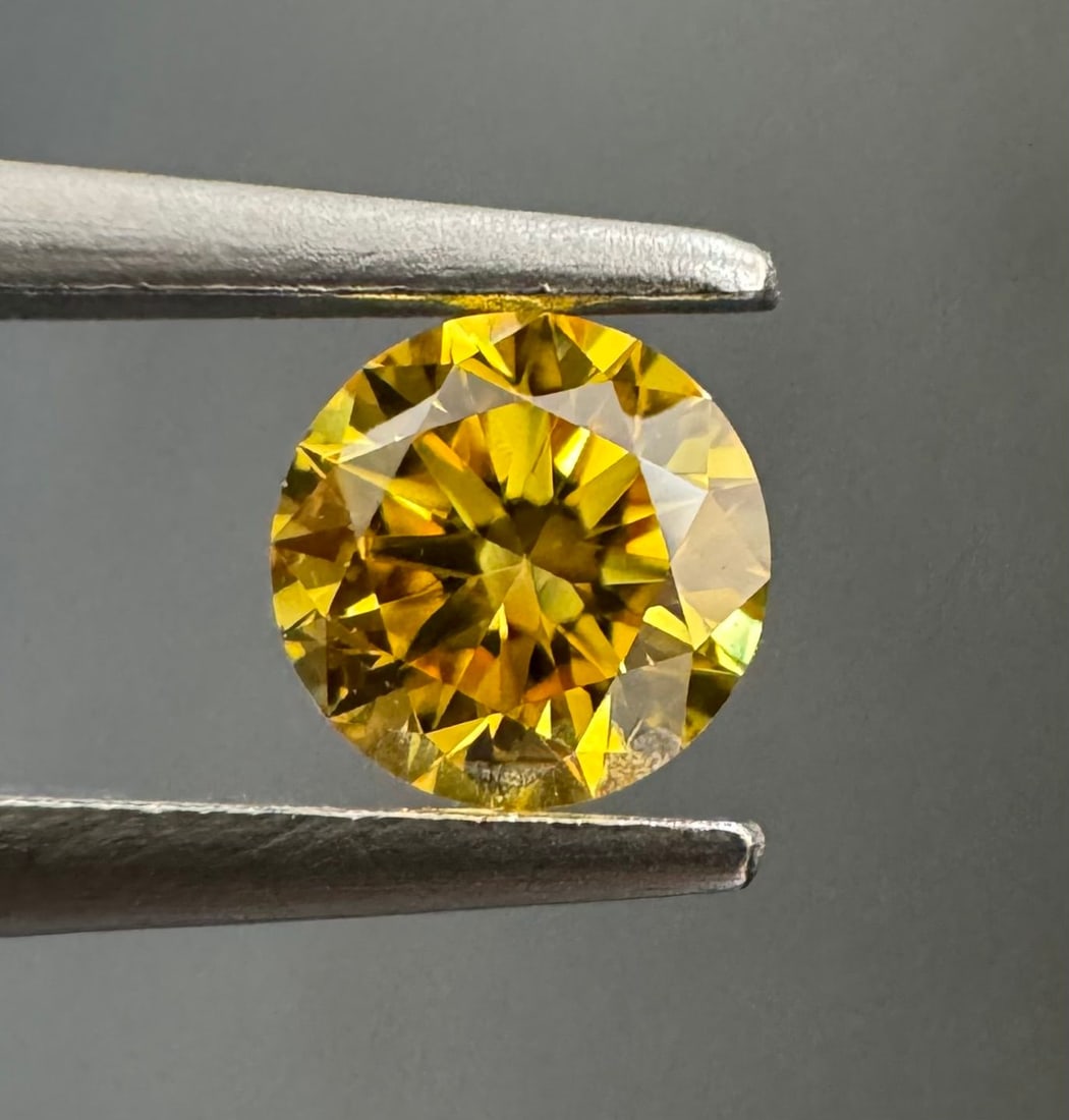 Loose Diamond - ROUND 0.18ct Fancy Vivid Orangey Yellow SI2: Loose Diamond - ROUND 0.18ct Fancy Vivid Orangey Yellow SI2 Source: Natural Shape: ROUND Carats: 0.18 Color: Fancy Vivid Orangey Yellow Certification: GIA PLEASE NOTE: Framed, Large, or heavy items do