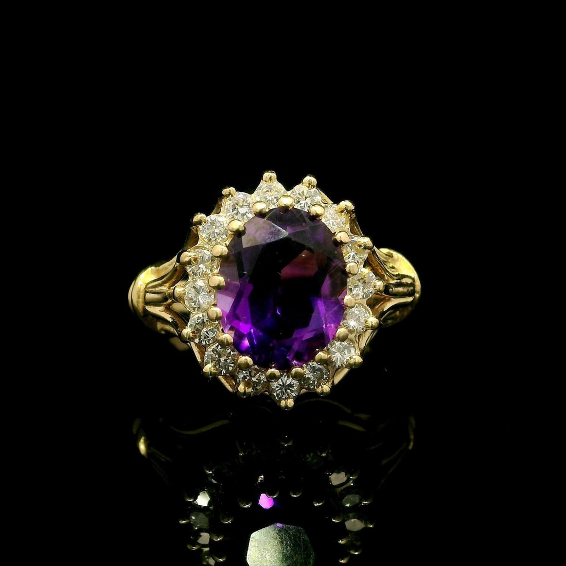 Vintage 14k Yellow Gold Amethyst Diamond Halo Cocktail Ring: Vintage 14k Yellow Gold Amethyst Diamond Halo Cocktail Ring This exquisite vintage cocktail ring features a stunning natural genuine amethyst in an oval cut, prong set in solid 14k yellow gold. The me