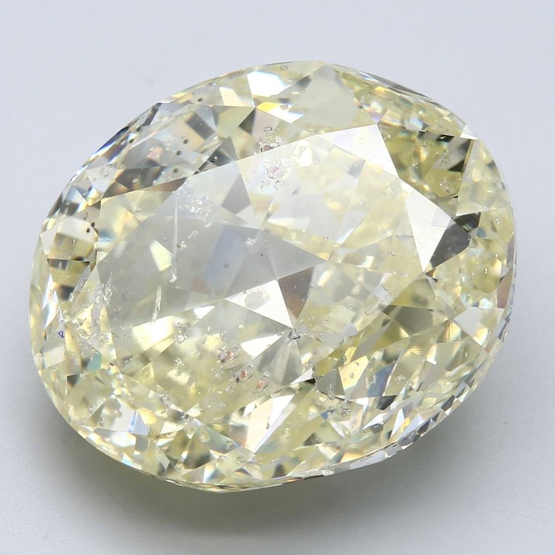 Loose Diamond - OVAL 52.63ct Fancy Yellow: Loose Diamond - OVAL 52.63ct Fancy Yellow Source: Natural Shape: OVAL Carats: 52.63 Color: Fancy Yellow Certification: GIA Video: