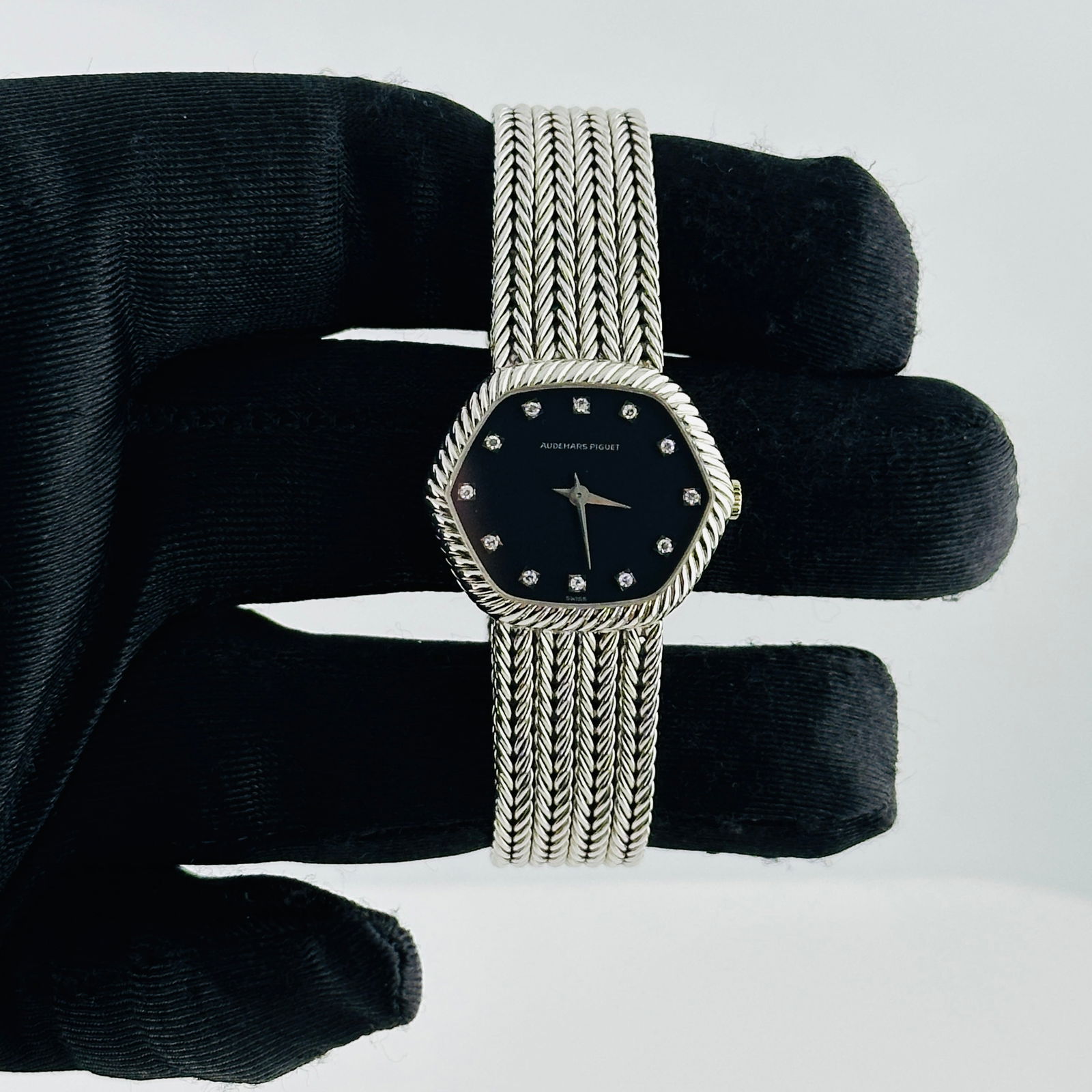 Ladies Audemars Piguet Cobra Black Diamond Dial White Gold Watch Ref 8674/460 with Papers: Ladies Audemars Piguet Cobra Black Diamond Dial White Gold Watch Ref 8674/460 with Papers This Audemars Piguet Cobra B&P ladies' watch features a black dial set with factory diamonds, complemented by