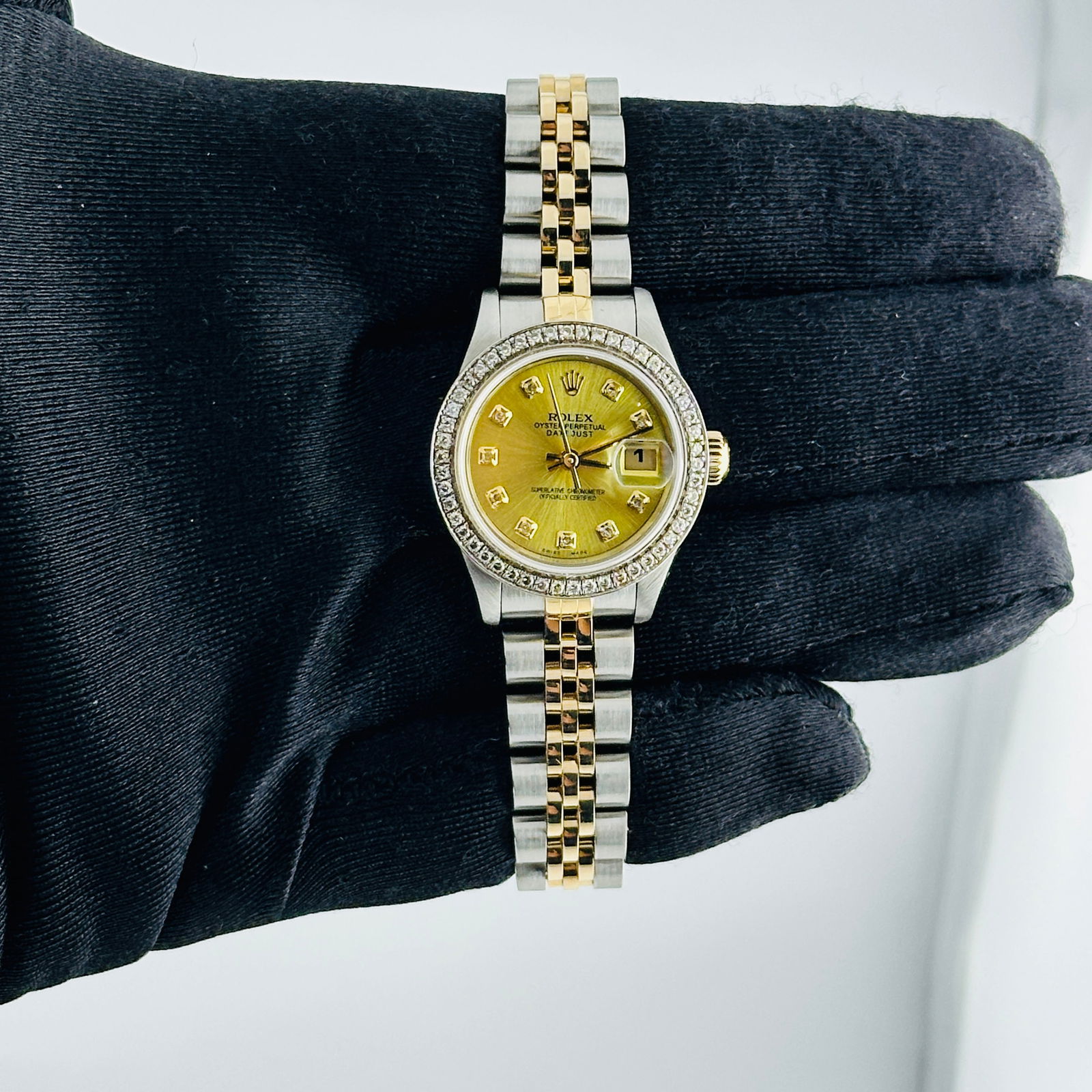 Ladies Datejust 79173 With Aftermarket Champagne Diamond Dial D Link Jubilee: Ladies Datejust 79173 With Aftermarket Champagne Diamond Dial D Link Jubilee This Rolex Datejust watch is designed for ladies and features an aftermarket champagne diamond dial. The bezel is set with