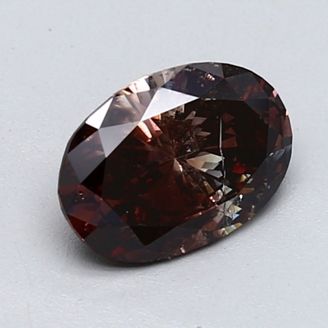 Loose Diamond - OVAL 1.2ct Fancy Dark Reddish Brown: Loose Diamond - OVAL 1.2ct Fancy Dark Reddish Brown Source: Natural Shape: OVAL Carats: 1.2 Color: Fancy Dark Reddish Brown Certification: GIA Video: