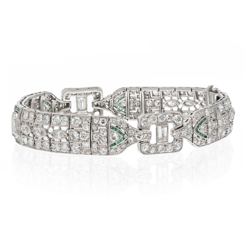 Oscar Heyman Circa 1925 Platinum Bracelet with Emeralds and Diamonds: Oscar Heyman Circa 1925 Platinum Bracelet with Emeralds and Diamonds This exquisite Oscar Heyman bracelet, crafted from platinum and dating back to circa 1925, showcases a stunning combination of cali