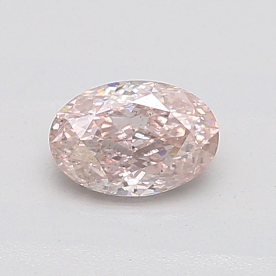 Loose Diamond - OVAL 0.51ct Fancy Orangey Pink SI1: Loose Diamond - OVAL 0.51ct Fancy Orangey Pink SI1 Source: Natural Shape: OVAL Carats: 0.51 Color: Fancy Orangey Pink Certification: GIA Video: