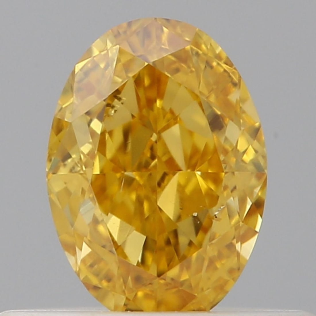 Loose Diamond - OVAL 0.34ct Fancy Vivid Orangey Yellow SI1: Loose Diamond - OVAL 0.34ct Fancy Vivid Orangey Yellow SI1 Source: Natural Shape: OVAL Carats: 0.34 Color: Fancy Vivid Orangey Yellow Certification: GIA Video: