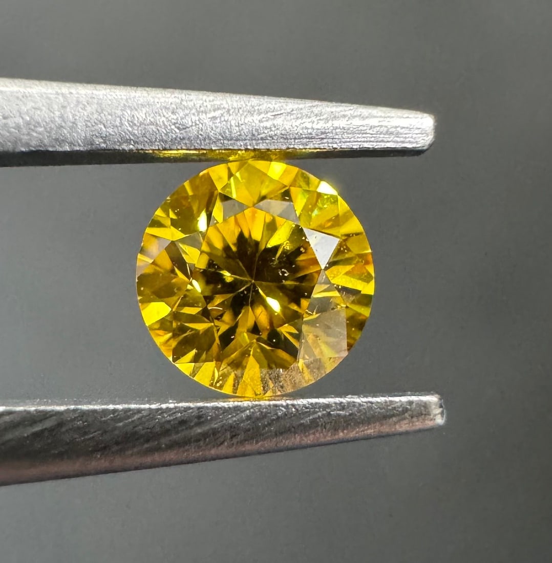 Loose Diamond - ROUND 0.21ct Fancy Vivid Orangey Yellow VS2: Loose Diamond - ROUND 0.21ct Fancy Vivid Orangey Yellow VS2 Source: Natural Shape: ROUND Carats: 0.21 Color: Fancy Vivid Orangey Yellow Certification: GIA PLEASE NOTE: Framed, Large, or heavy items do