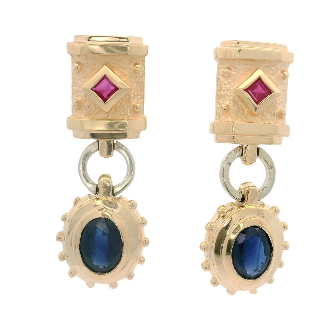 14k Yellow Gold Dangle Earrings with Oval Sapphire and Square Ruby: 14k Yellow Gold Dangle Earrings with Oval Sapphire and Square Ruby Elevate your jewelry collection with these exquisite dangle drop earrings, featuring stunning natural gemstones. Each earring showcas