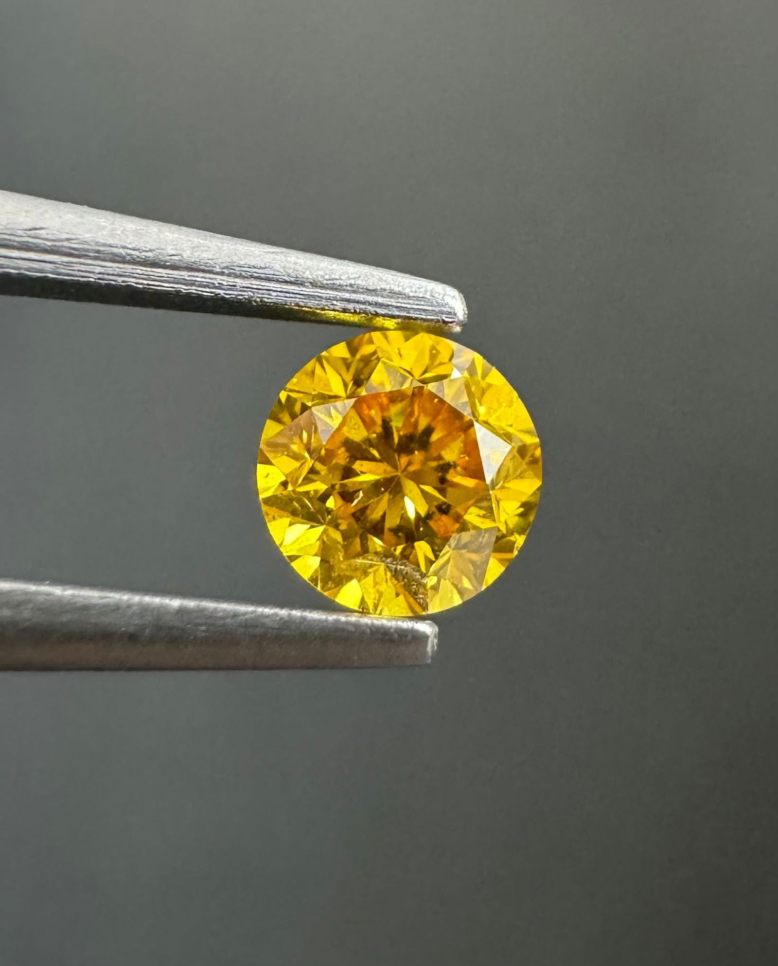 Loose Diamond - ROUND 0.24ct Fancy Vivid Orangey Yellow I1: Loose Diamond - ROUND 0.24ct Fancy Vivid Orangey Yellow I1 Source: Natural Shape: ROUND Carats: 0.24 Color: Fancy Vivid Orangey Yellow Certification: GIA Video: