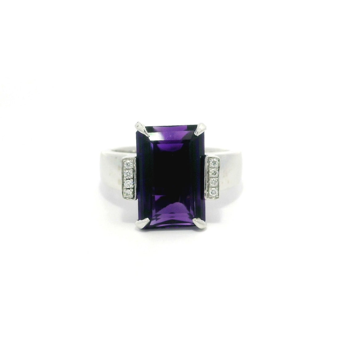 14k White Gold 5.68ct Rectangular Amethyst Ring with Diamonds: 14k White Gold 5.68ct Rectangular Amethyst Ring with Diamonds This exquisite cocktail ring features a stunning natural amethyst at its center, showcasing a rectangular step cut with a deep purple hue.