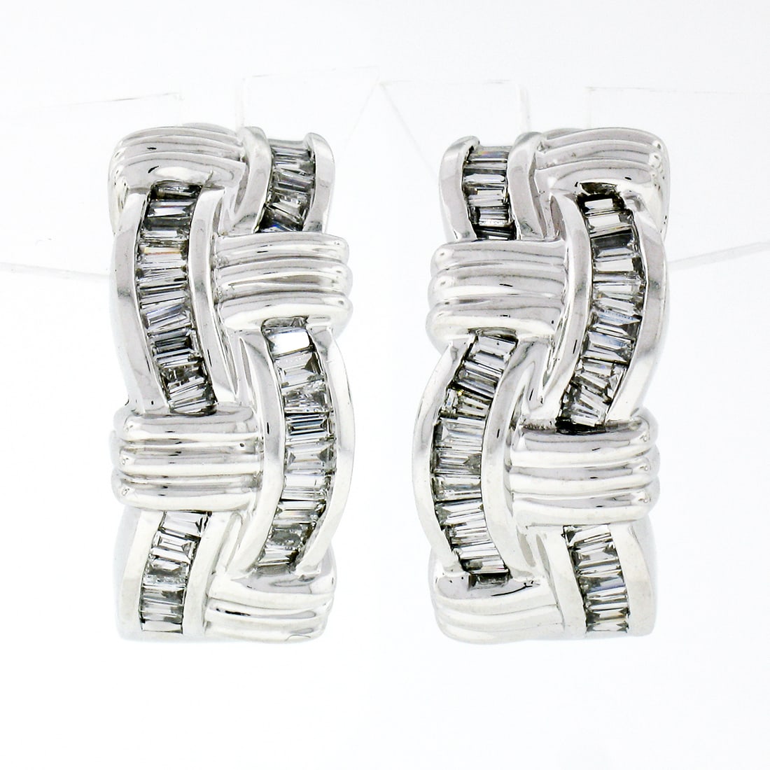 Estate 14K White Gold 1.5ctw Baguette Diamond Cuff Earrings: Estate 14K White Gold 1.5ctw Baguette Diamond Cuff Earrings Elevate your style with these stunning estate cuff earrings, expertly crafted from solid 14K white gold. Featuring a unique intertwined desi