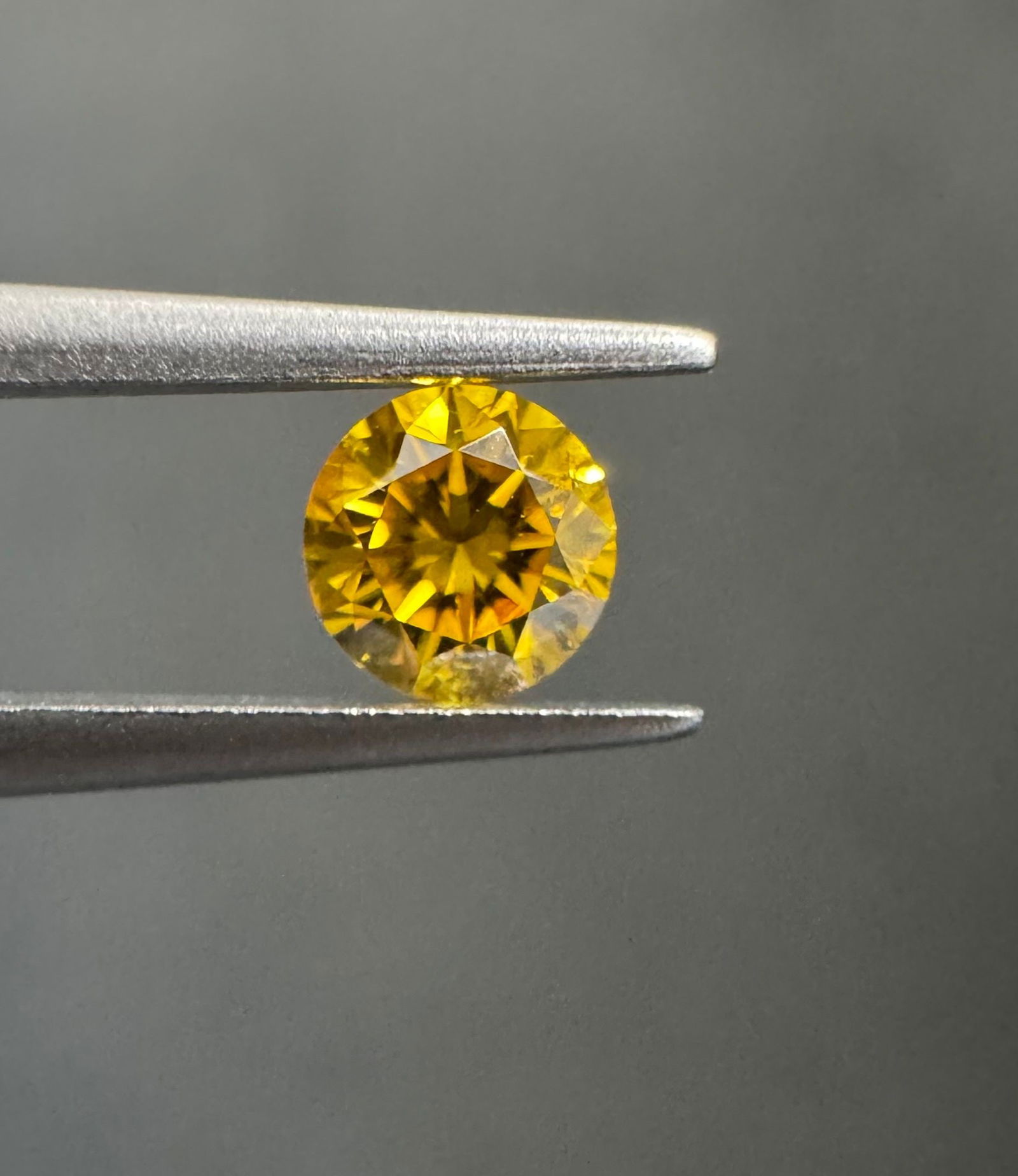 Loose Diamond - ROUND 0.26ct Fancy Vivid Orangey Yellow I1: Loose Diamond - ROUND 0.26ct Fancy Vivid Orangey Yellow I1 Source: Natural Shape: ROUND Carats: 0.26 Color: Fancy Vivid Orangey Yellow Certification: GIA PLEASE NOTE: Framed, Large, or heavy items do