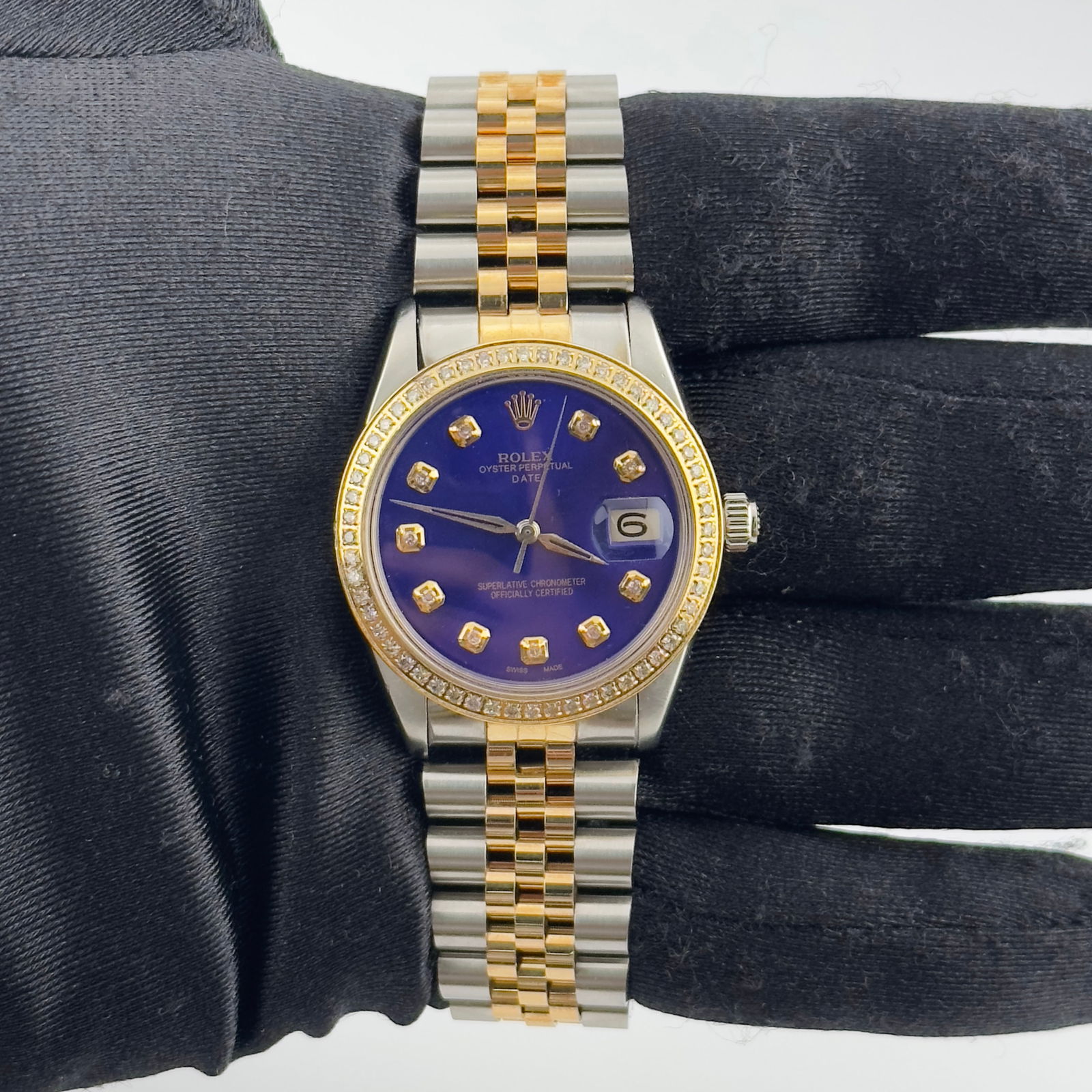 Oyster Perpetual Date 6694 Watch Royal Blue Dial With Aftermarket Jubilee Bracelet: Oyster Perpetual Date 6694 Watch Royal Blue Dial With Aftermarket Jubilee Bracelet This Rolex Oyster Perpetual Date features a striking royal blue dial and is equipped with an aftermarket Jubilee brac