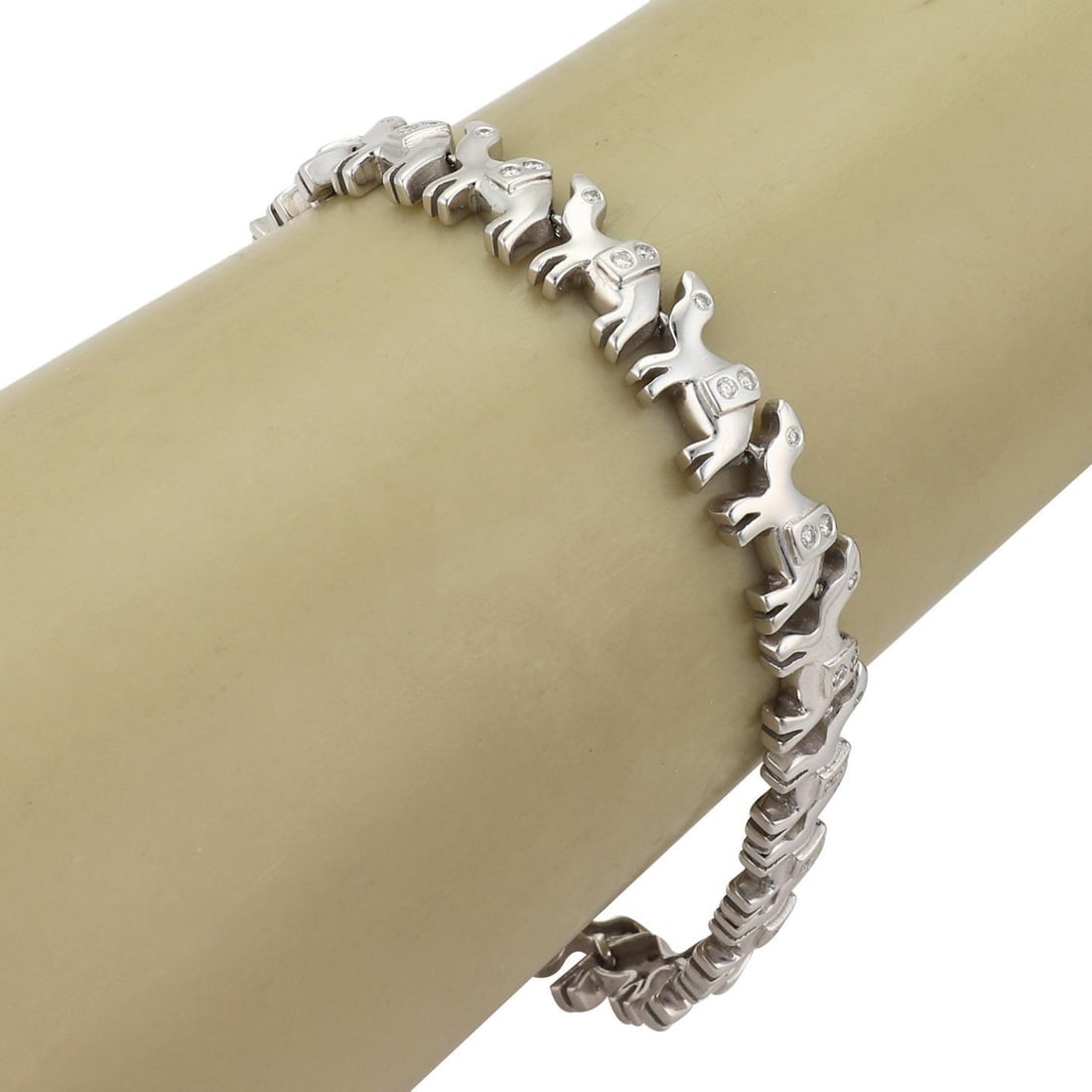 18k White Gold Camel Bracelet with Diamonds 8 Inch: 18k White Gold Camel Bracelet with Diamonds 8 Inch This charming bracelet is expertly crafted from 18k white gold featuring a high polished finish. It showcases 17 intricately designed full figure cam