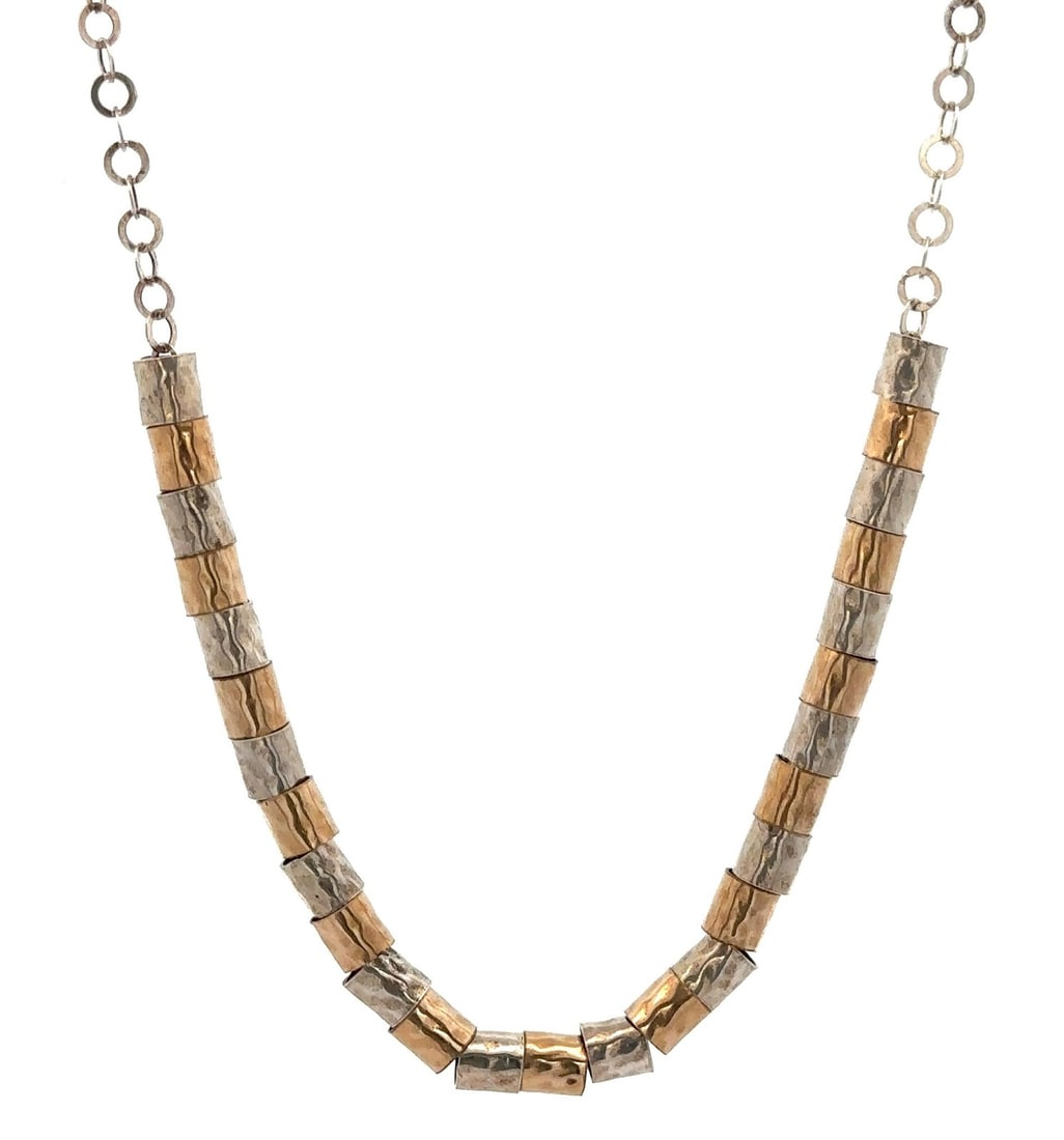 Sterling Silver Yellow Gold Filled Hammered Tube Charm Necklace: Sterling Silver Yellow Gold Filled Hammered Tube Charm Necklace This stunning necklace features a unique design with hammered sliding tube charms crafted from sterling silver and yellow gold filled ma