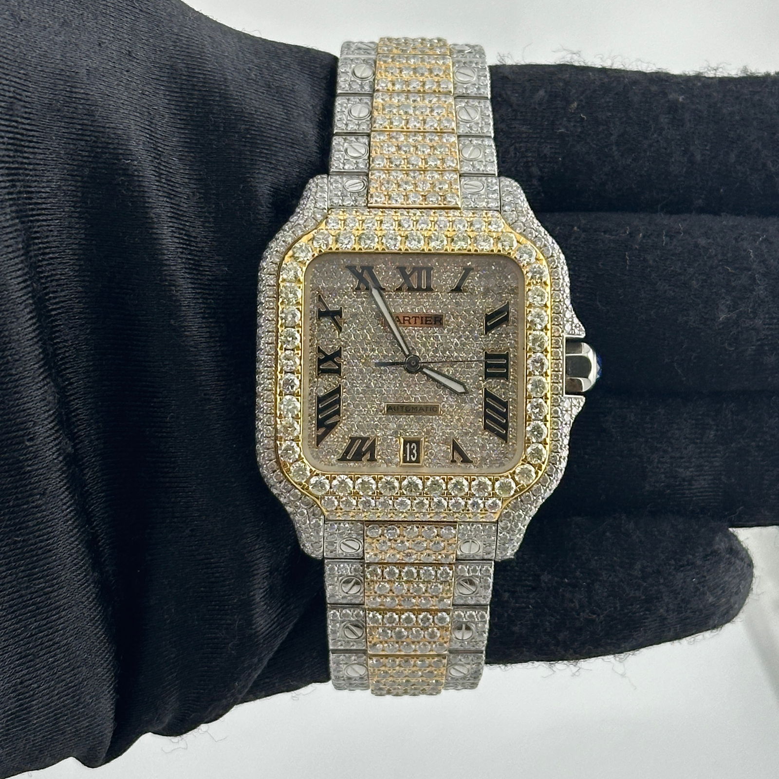 Diamond Custom Cartier Santos Ref 4072 Roman Numerals Dial with Papers 2014: Diamond Custom Cartier Santos Ref 4072 Roman Numerals Dial with Papers 2014 This Cartier Santos watch, reference 4072, features an iced out Roman dial, a diamond bezel, and an iced out bracelet. The w