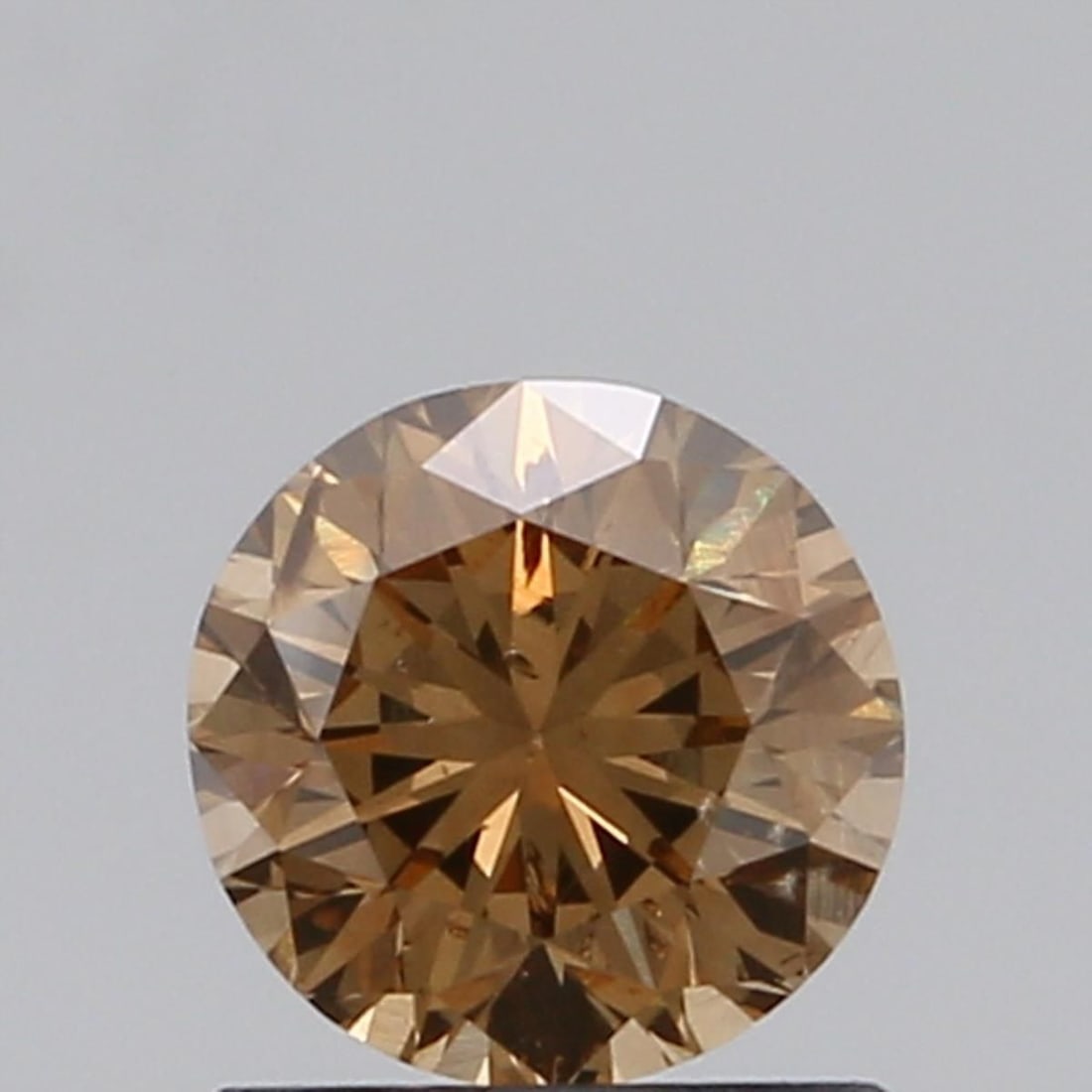 Loose Diamond - ROUND 0.91ct Fancy Brown SI2: Loose Diamond - ROUND 0.91ct Fancy Brown SI2 Source: Natural Shape: ROUND Carats: 0.91 Color: Fancy Brown Certification: NONE Video: