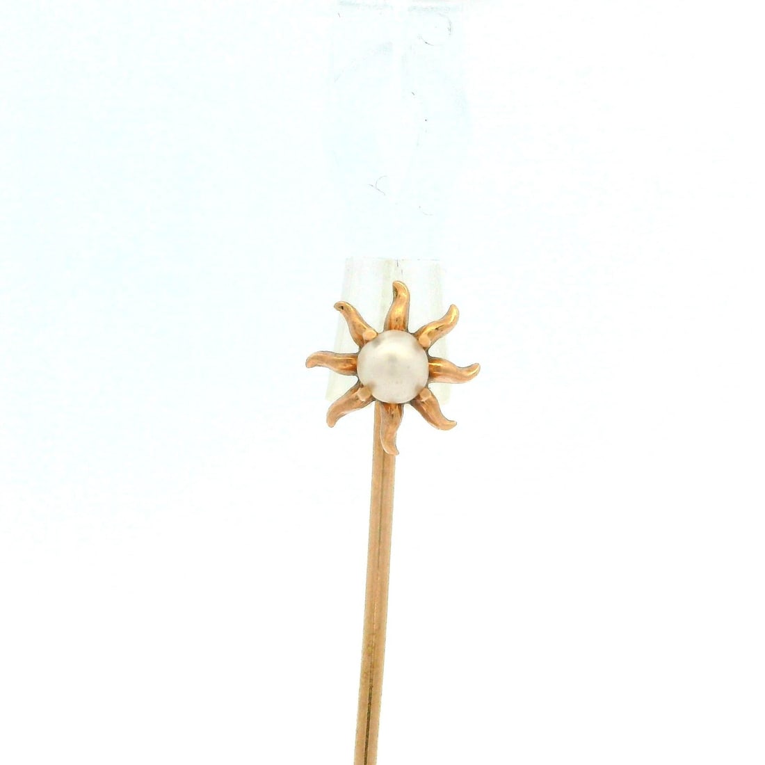 Vintage 10k Yellow Gold Flared Sun Stick Pin with Round Pearl: Vintage 10k Yellow Gold Flared Sun Stick Pin with Round Pearl This exquisite vintage stick pin features a petite flared sun design crafted from solid 10k yellow gold. At its center, it showcases a gen