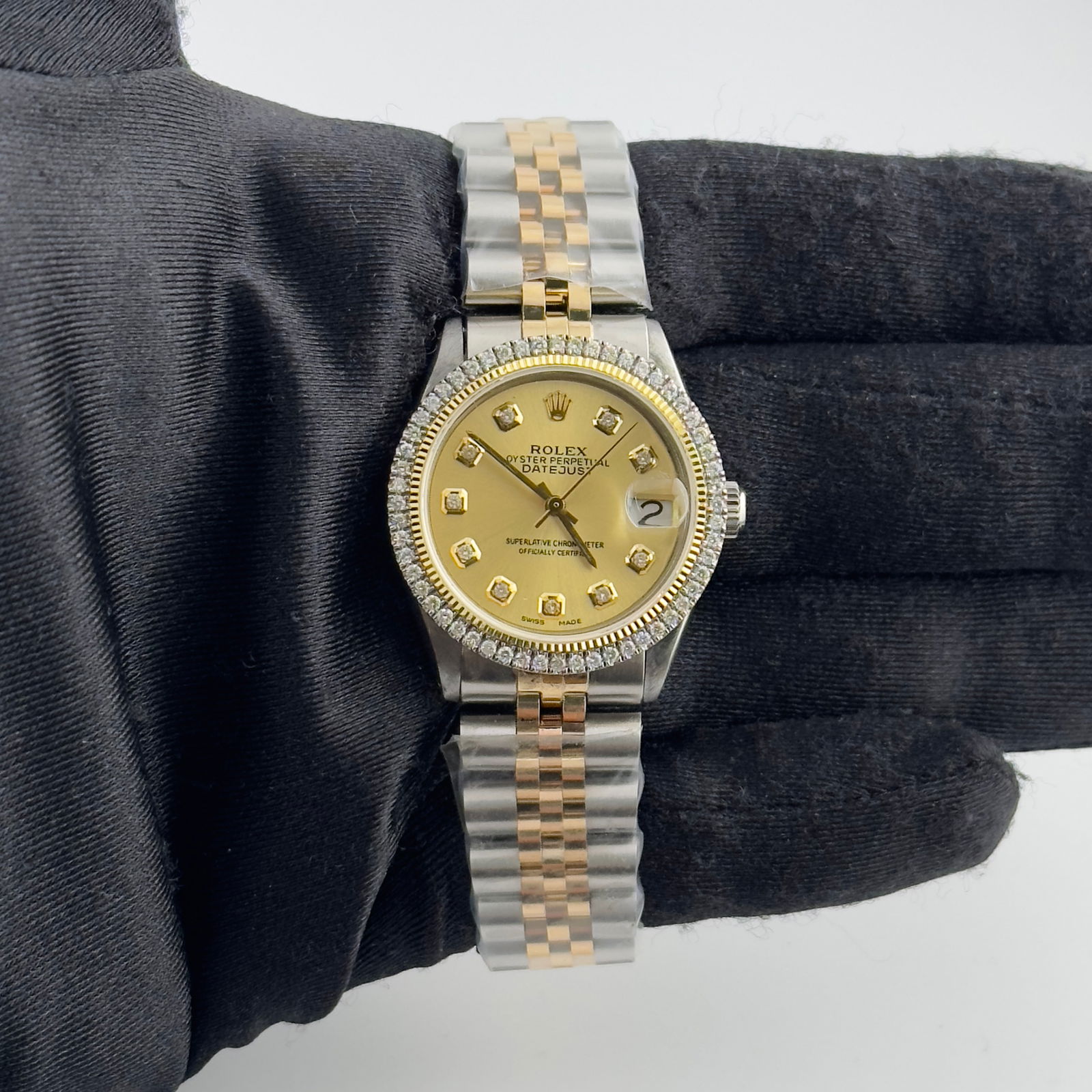 Ladies Rolex Datejust Ref 6466 Aftermarket Champagne Diamond Dial Jubilee Bracelet: Ladies Rolex Datejust Ref 6466 Aftermarket Champagne Diamond Dial Jubilee Bracelet This ladies Rolex Datejust features an aftermarket champagne diamond dial and a prong plated diamond bezel. The watch