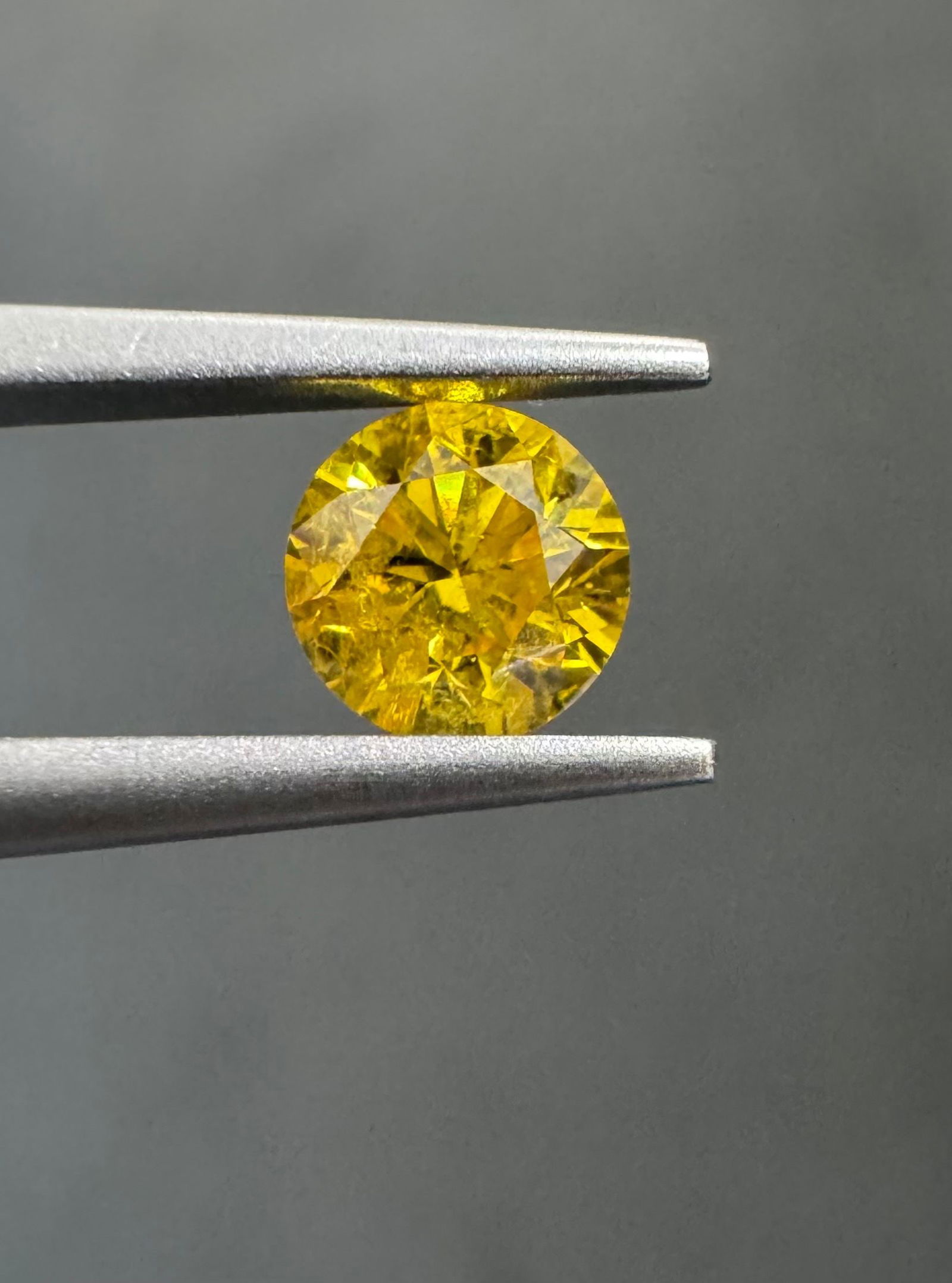 Loose Diamond - ROUND 0.42ct Fancy Vivid Orangey Yellow I3: Loose Diamond - ROUND 0.42ct Fancy Vivid Orangey Yellow I3 Source: Natural Shape: ROUND Carats: 0.42 Color: Fancy Vivid Orangey Yellow Certification: GIA PLEASE NOTE: Framed, Large, or heavy items do