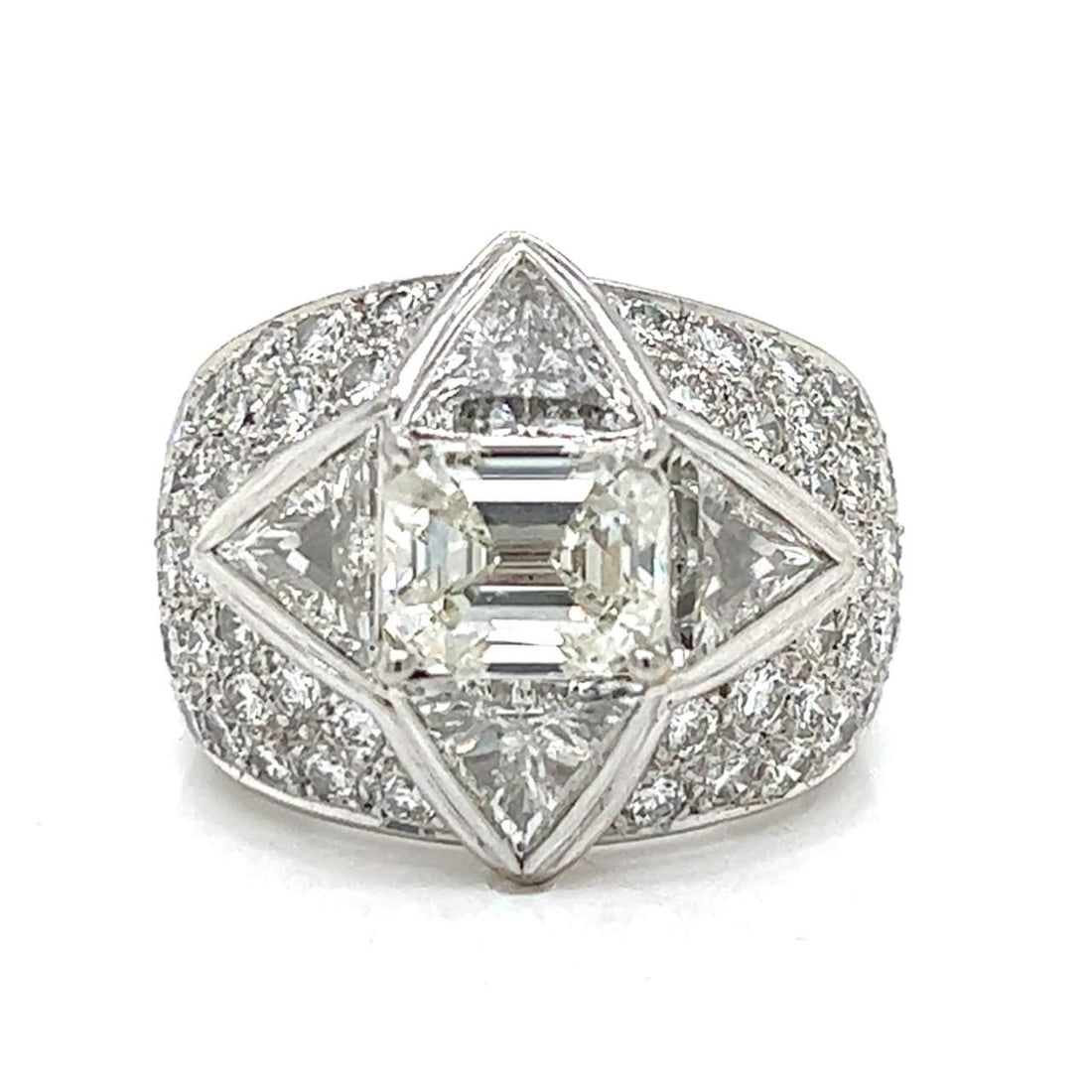 18K White Gold Diamond Cocktail Ring 2.49 Ct Emerald-cut and Trillion Diamonds: 18K White Gold Diamond Cocktail Ring 2.49 Ct Emerald-cut and Trillion Diamonds This stunning 18K White Gold Diamond Cocktail Ring features a breathtaking 2.49 Ct. emerald-cut diamond at its center, ex