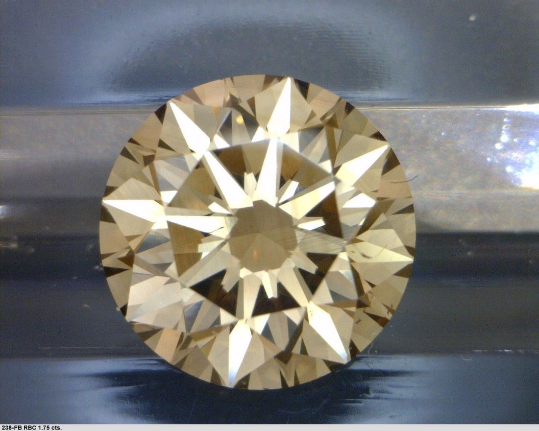 Loose Diamond - ROUND 1.75ct Fancy Dark Yellowish Brown SI1: Loose Diamond - ROUND 1.75ct Fancy Dark Yellowish Brown SI1 Source: Natural Shape: ROUND Carats: 1.75 Color: Fancy Dark Yellowish Brown Certification: GIA PLEASE NOTE: Framed, Large, or heavy items do