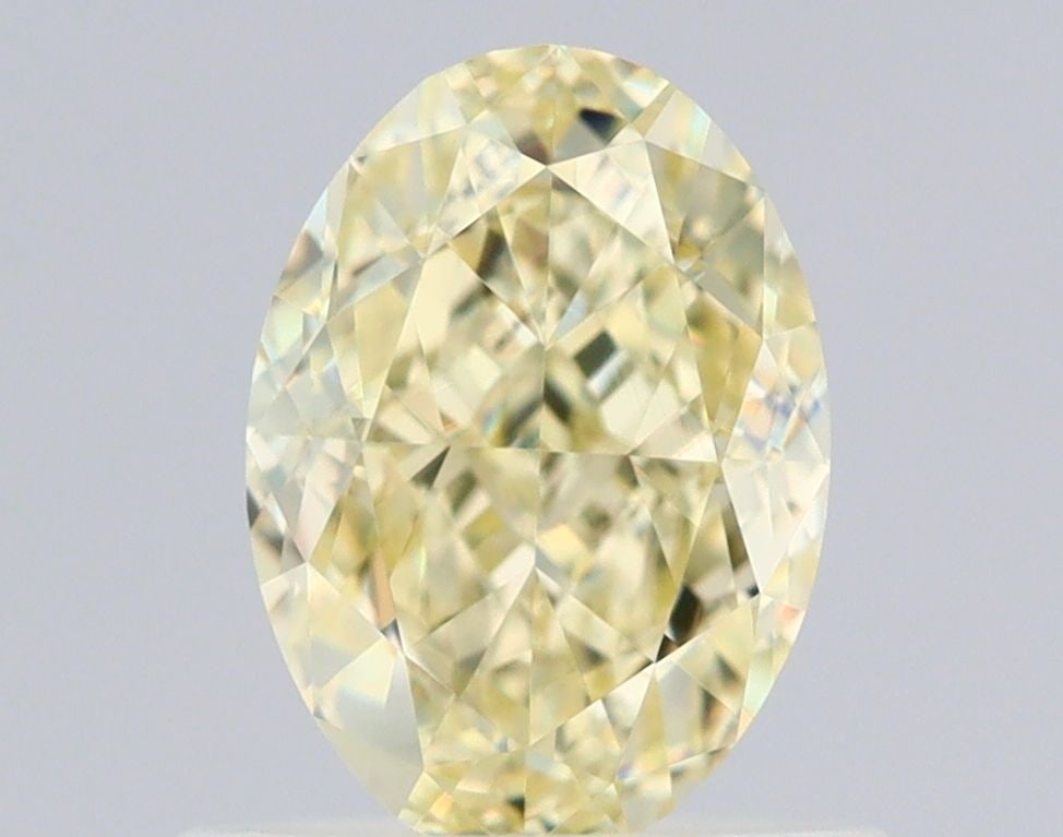 Loose Diamond - OVAL 0.93ct Fancy Light Yellow VVS2: Loose Diamond - OVAL 0.93ct Fancy Light Yellow VVS2 Source: Natural Shape: OVAL Carats: 0.93 Color: Fancy Light Yellow Certification: GIA Video:
