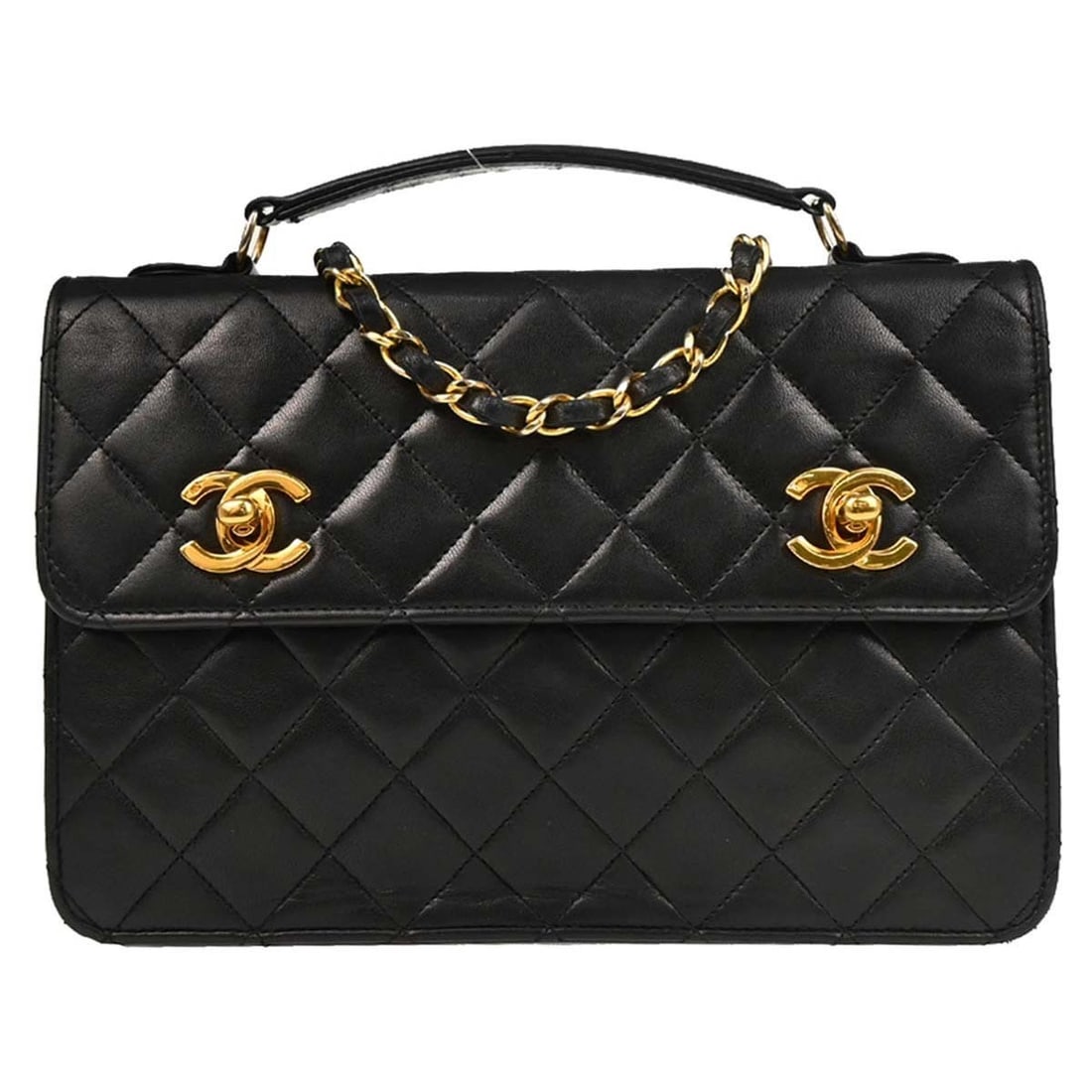 Chanel Black Lambskin 2way Top Handle Handbag CC: Chanel Black Lambskin 2way Top Handle Handbag CC This elegant Chanel 2way handbag is crafted from luxurious black lambskin, offering a sophisticated touch for casual occasions. The medium-sized bag fe