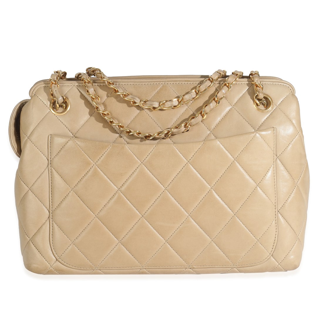 Chanel Vintage Beige Quilted Lambskin Camera Bag with Gold-Tone Hardware: Chanel Vintage Beige Quilted Lambskin Camera Bag with Gold-Tone Hardware This vintage Chanel Camera Bag is a stunning accessory crafted from luxurious beige quilted lambskin leather. Originating from