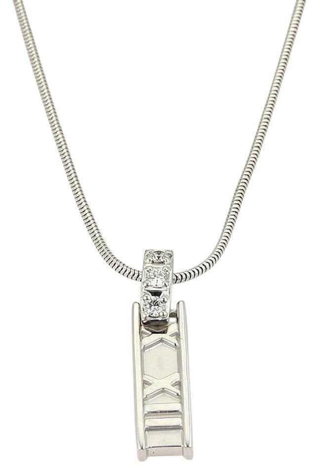 Tiffany & Co. Atlas Pendant Necklace 18k White Gold Diamond: Tiffany & Co. Atlas Pendant Necklace 18k White Gold Diamond Elevate your style with this stunning necklace from Tiffany & Co.'s Atlas collection. Crafted from luxurious 18k white gold, this necklace f