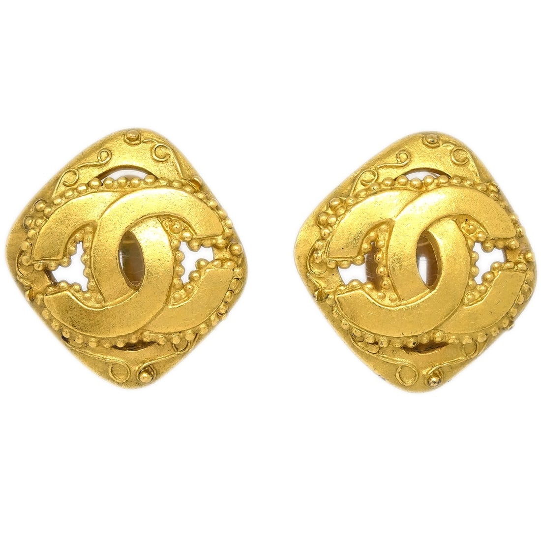 Chanel 96A Gold Rhombus Clip-On Button Earrings: Chanel 96A Gold Rhombus Clip-On Button Earrings Elevate your accessory collection with these stunning Chanel Rhombus Clip-On Earrings. Crafted by the renowned brand Chanel, these earrings feature a un