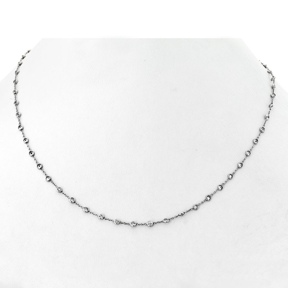 18K White Gold 51 Stone Diamonds by the Yard Necklace: 18K White Gold 51 Stone Diamonds by the Yard Necklace This exquisite Diamonds by the Yard necklace features 51 sparkling diamonds elegantly set in 18K white gold. The necklace measures 16 inches in le