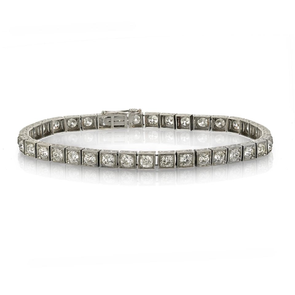 Platinum Art Deco Bracelet with 36 Old Cut Diamonds 7.25 Inch: Platinum Art Deco Bracelet with 36 Old Cut Diamonds 7.25 Inch This Art Deco straight line bracelet is crafted in platinum and features 36 old-cut diamonds with a total approximate weight of 9 carats.