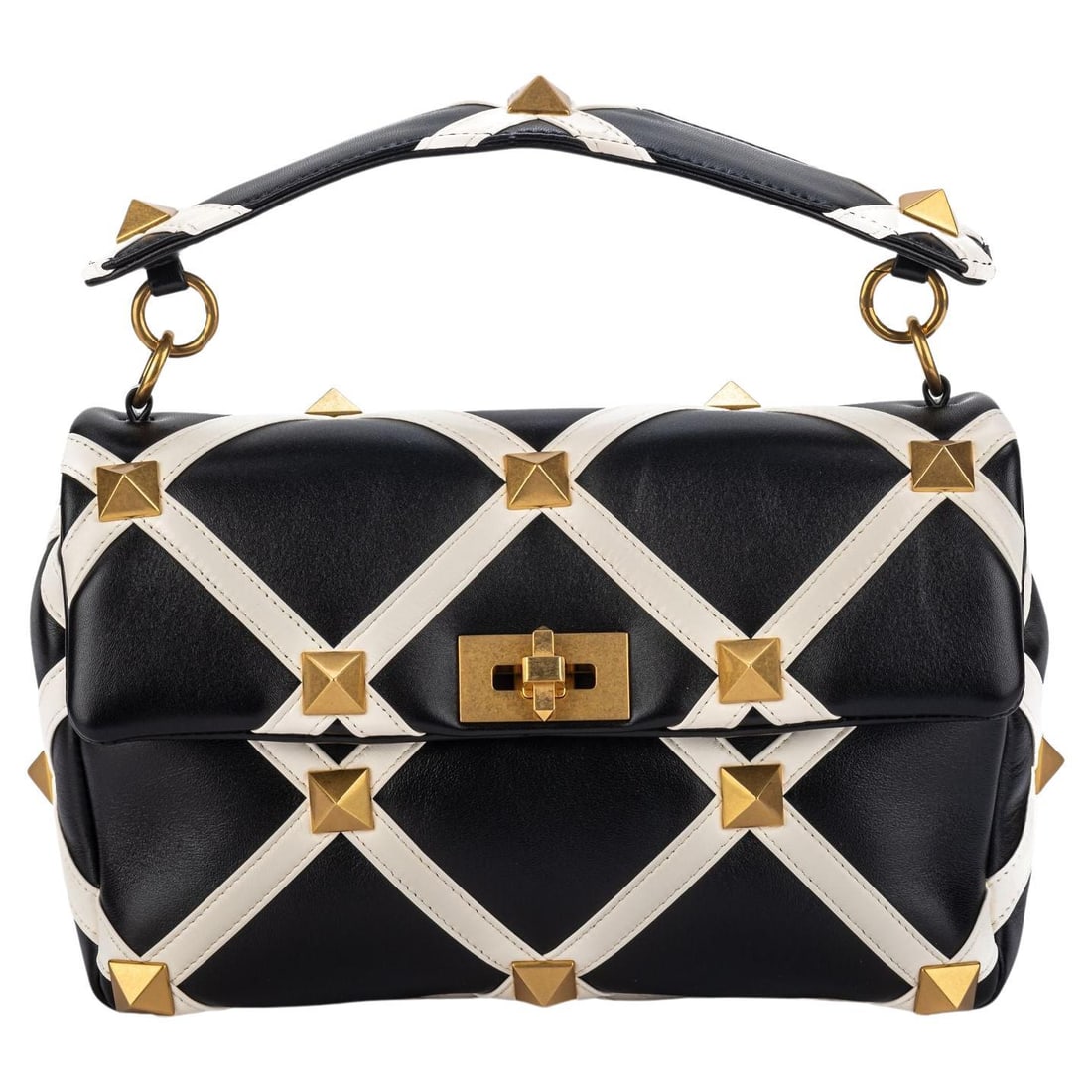 Valentino Black White Roman Stud Large Bag with Gold Studs: Valentino Black White Roman Stud Large Bag with Gold Studs Introducing the Valentino New Black & White Roman Stud Large Bag, an exquisite piece crafted from premium leather in a striking black and whi