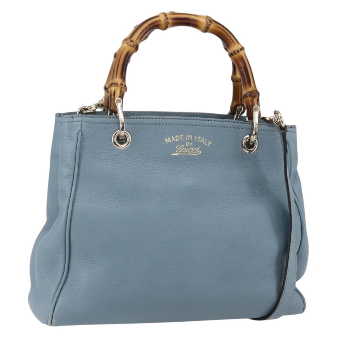 Blue Bamboo Shopper Tote Bag by Gucci: Blue Bamboo Shopper Tote Bag by Gucci This pre-owned Gucci Bamboo Shopper Tote features a blue exterior with signature bamboo handles. The handbag shows signs of use, including surface rubbing, slight